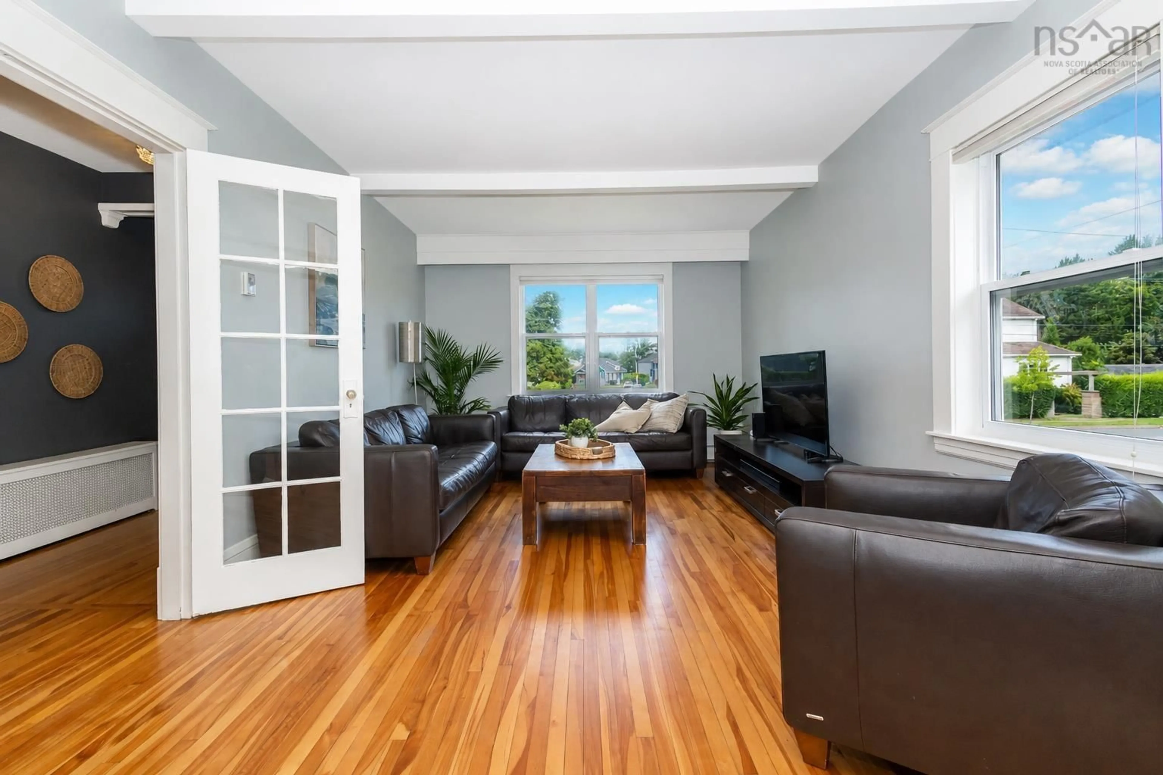 Living room with furniture, wood/laminate floor for 84 Union St, Sydney Nova Scotia B1P 4X5