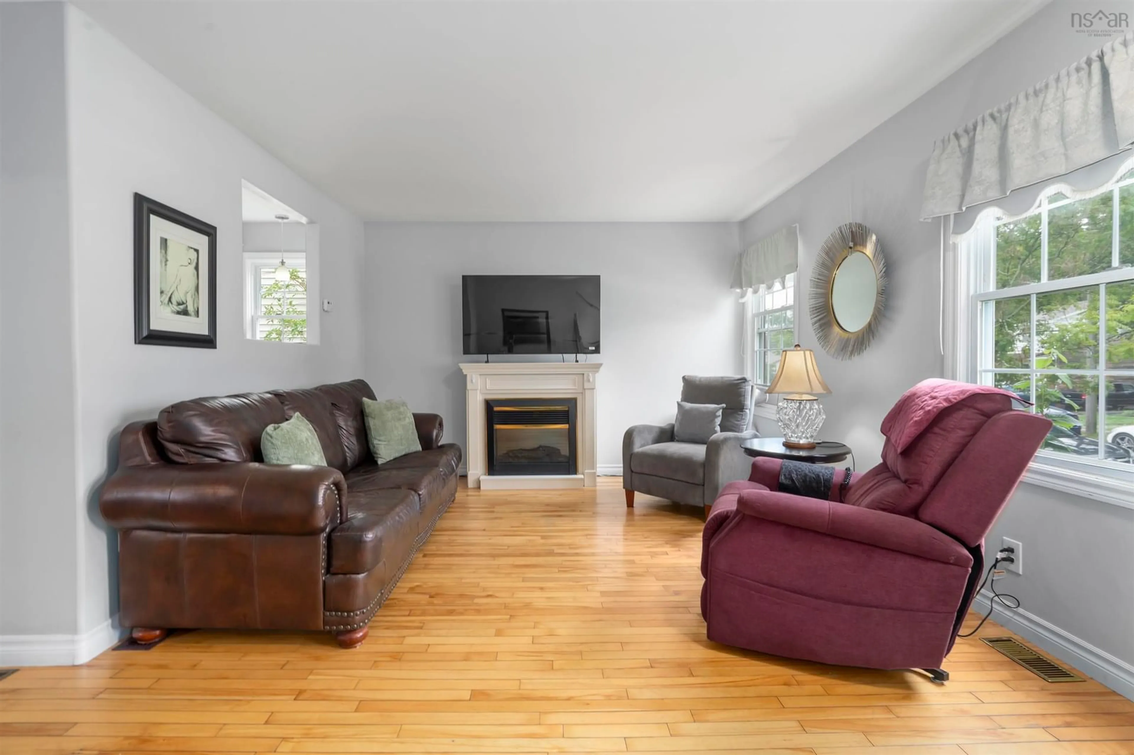 Living room with furniture, wood/laminate floor for 3206 Micmac St, Halifax Nova Scotia B3L 3W4