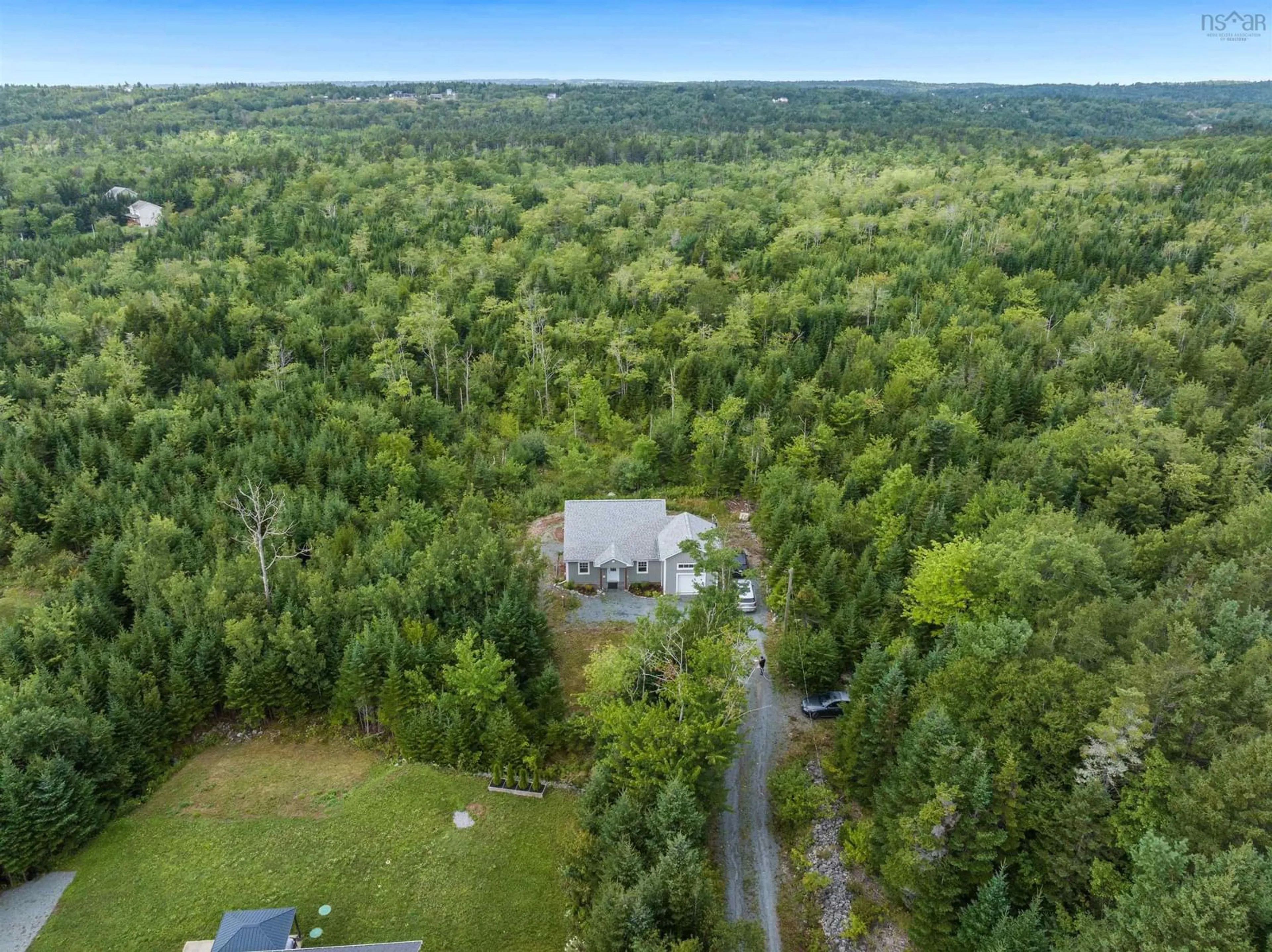 A pic from outside/outdoor area/front of a property/back of a property/a pic from drone, forest/trees view for 111 Mineville Rd, East Preston Nova Scotia B2Z 1K4