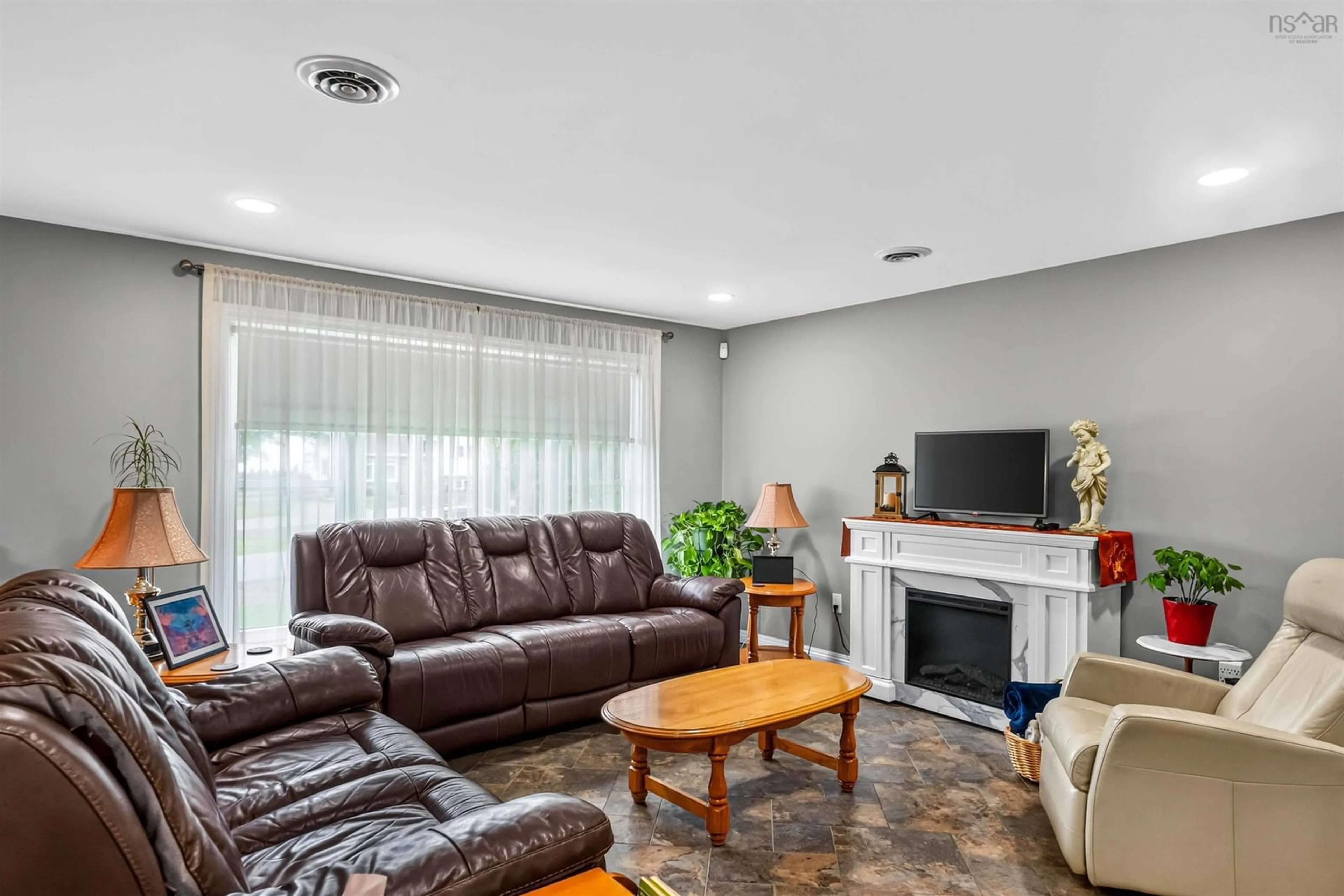 Living room with furniture, ceramic/tile floor for 1008 Country Club Blvd, New Minas Nova Scotia B4N 4W8