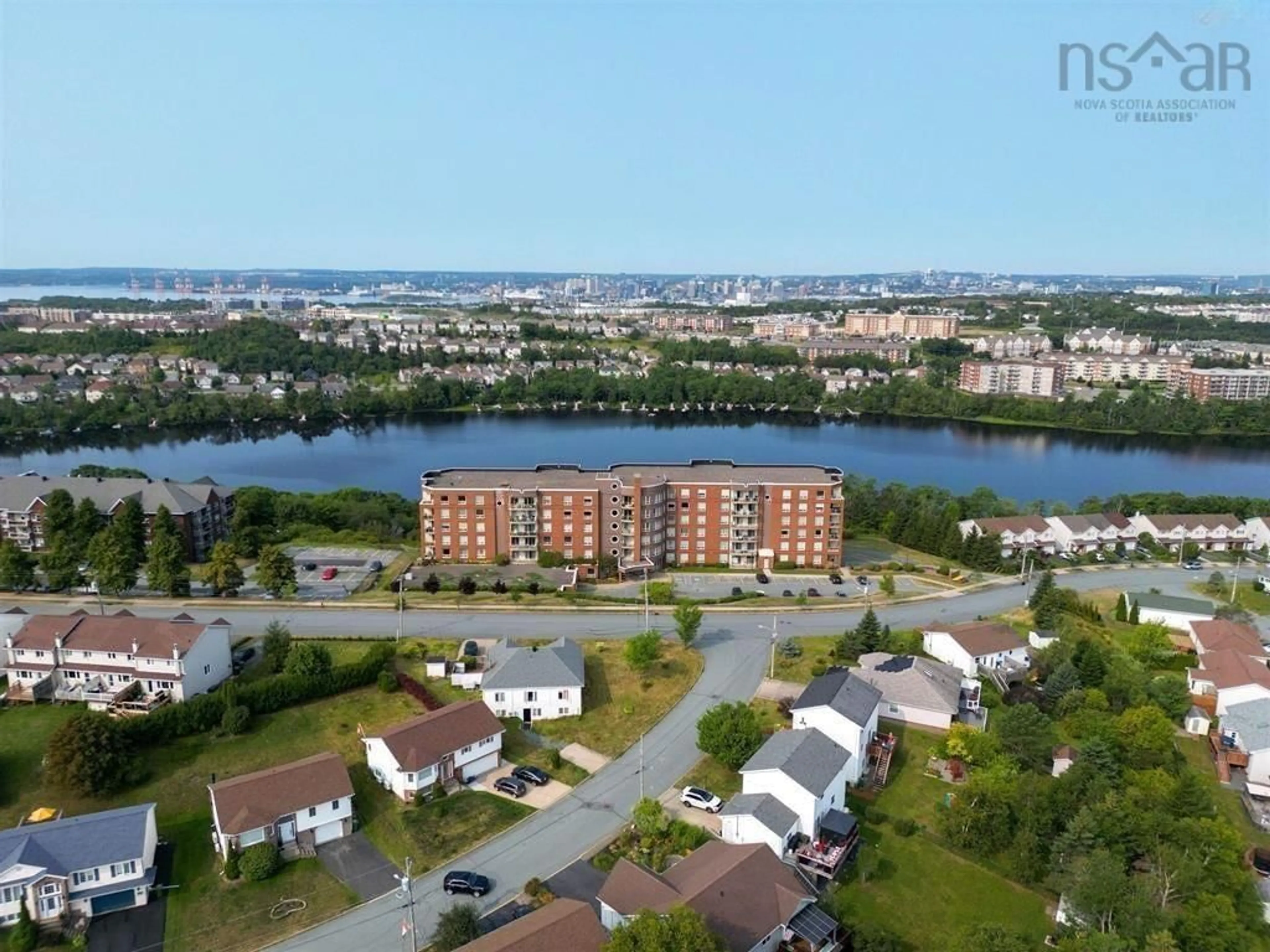 A pic from outside/outdoor area/front of a property/back of a property/a pic from drone, water/lake/river/ocean view for 77 Russell Lake Dr #406, Dartmouth Nova Scotia B2W 6R8