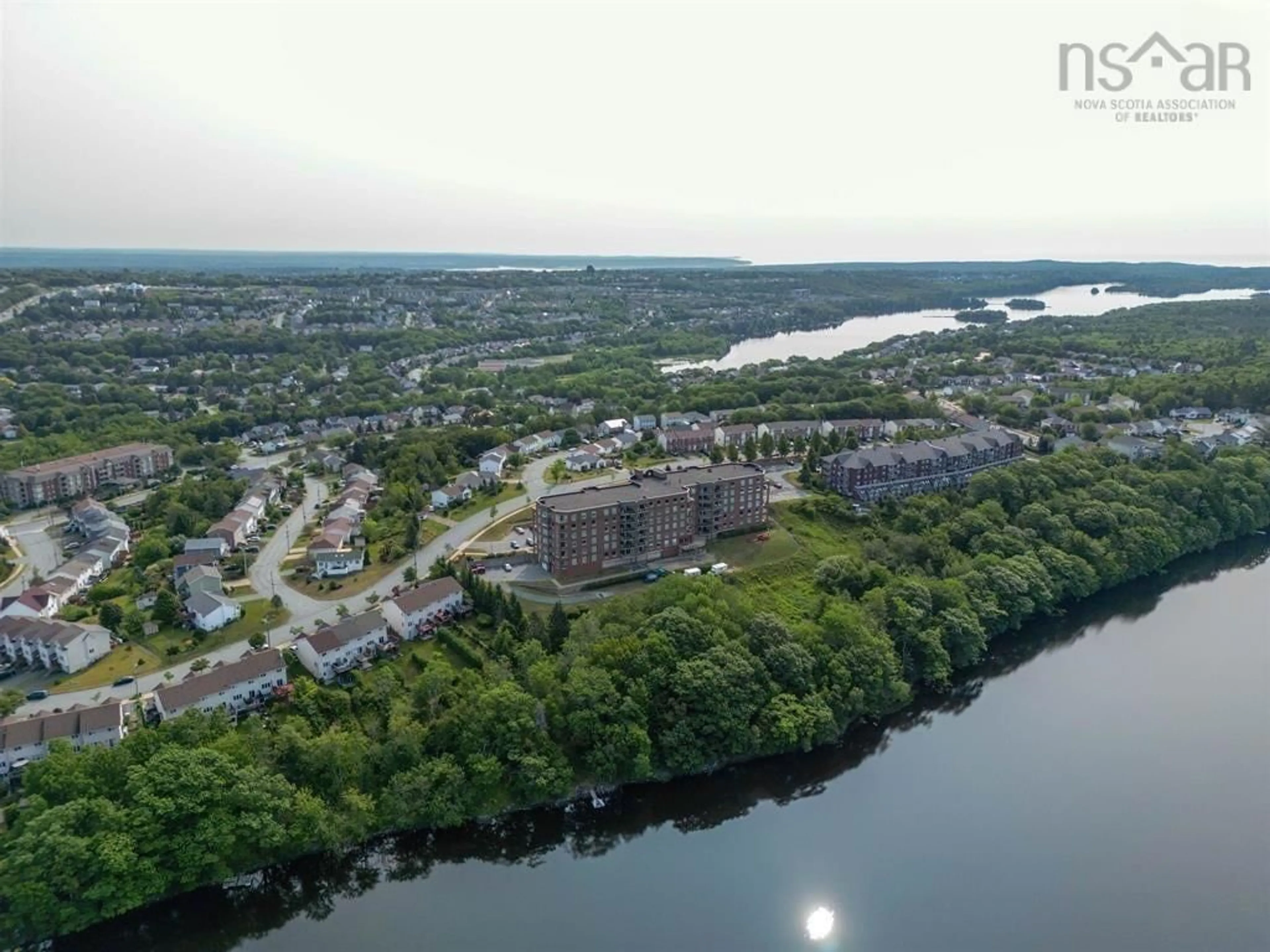 A pic from outside/outdoor area/front of a property/back of a property/a pic from drone, water/lake/river/ocean view for 77 Russell Lake Dr #406, Dartmouth Nova Scotia B2W 6R8