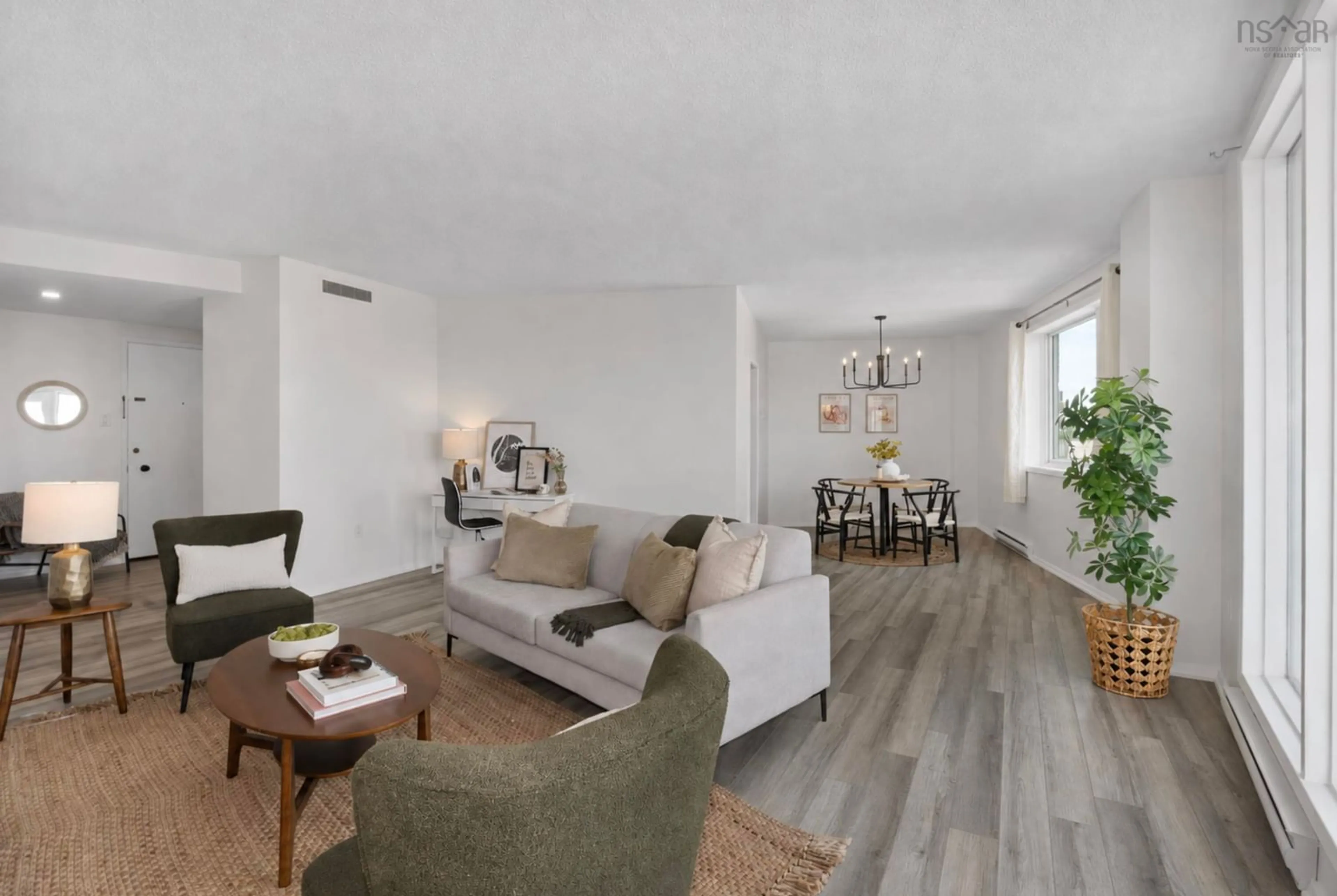 Living room with furniture, wood/laminate floor for 1074 Wellington St #1002, Halifax Peninsula Nova Scotia B3H 2Z8