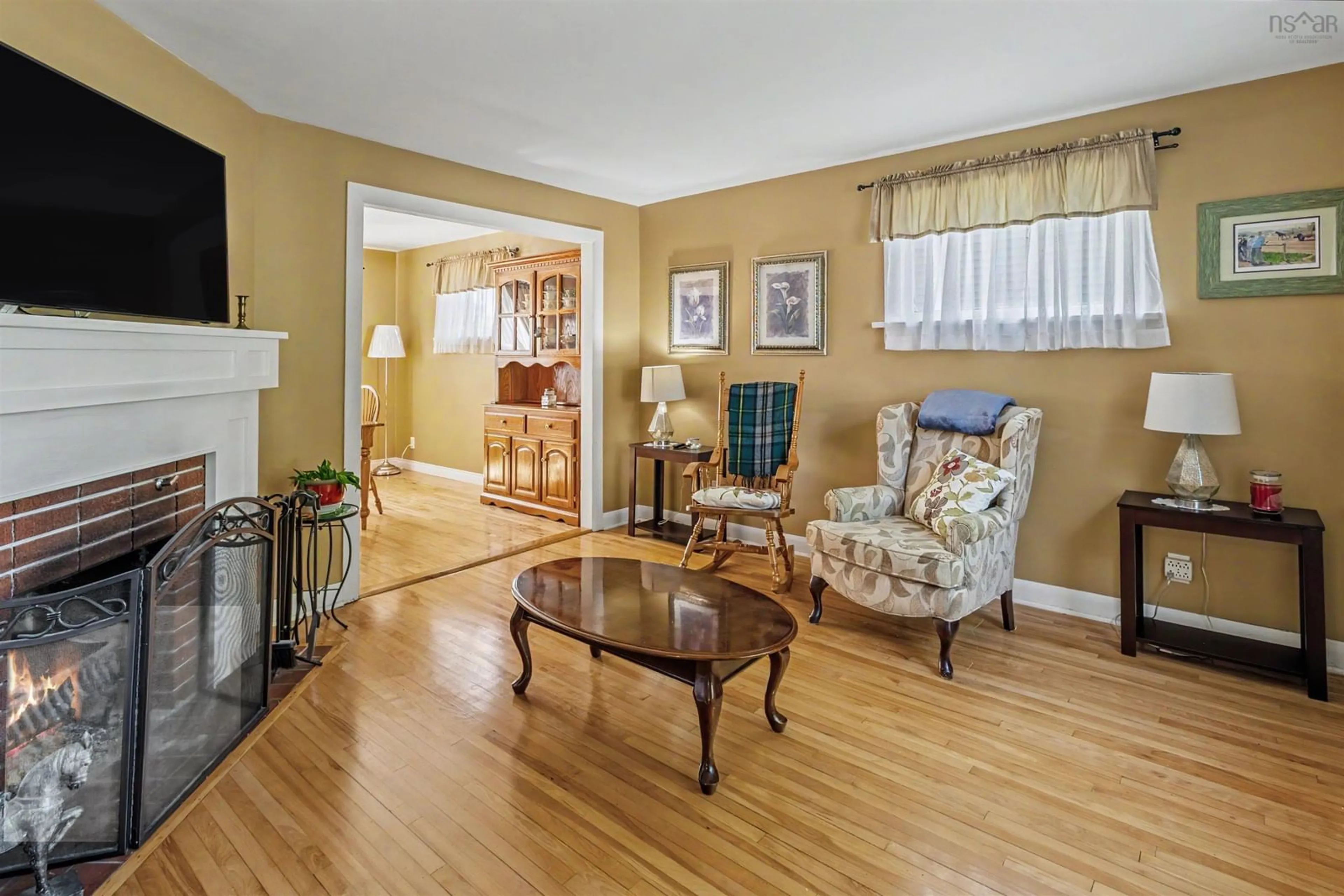 Living room with furniture, wood/laminate floor for 196 St. Peters Rd, Sydney Nova Scotia B1P 4P8