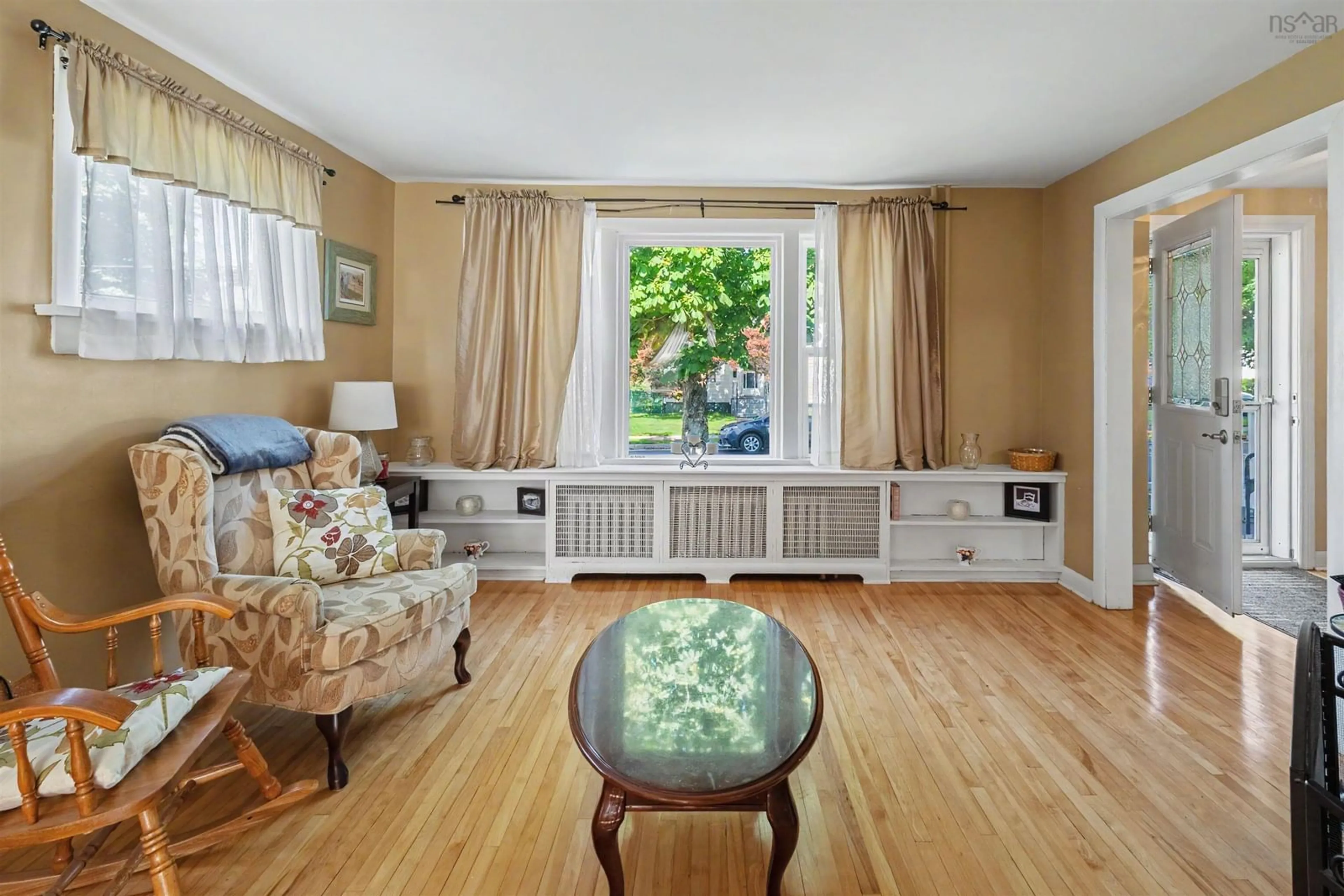 Living room with furniture, wood/laminate floor for 196 St. Peters Rd, Sydney Nova Scotia B1P 4P8