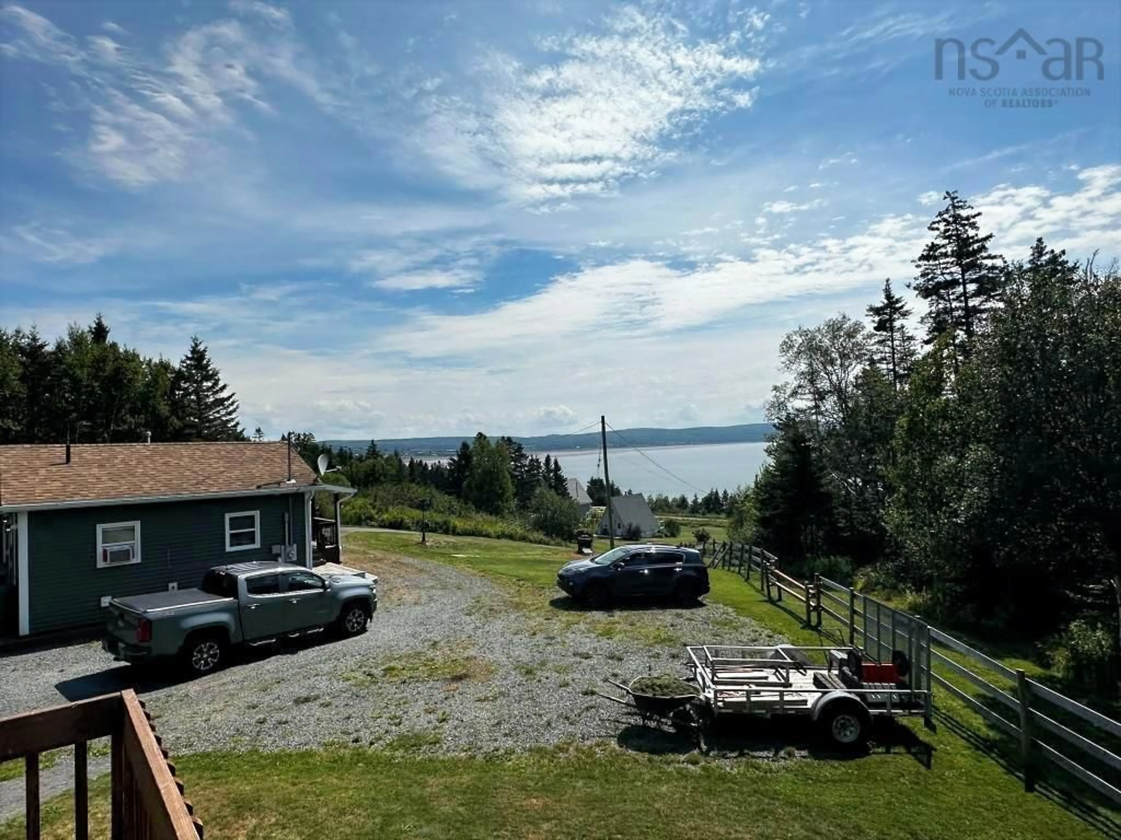 A pic from outside/outdoor area/front of a property/back of a property/a pic from drone, water/lake/river/ocean view for 1079 Cape Split Rd, Scots Bay Nova Scotia B0P 1H0