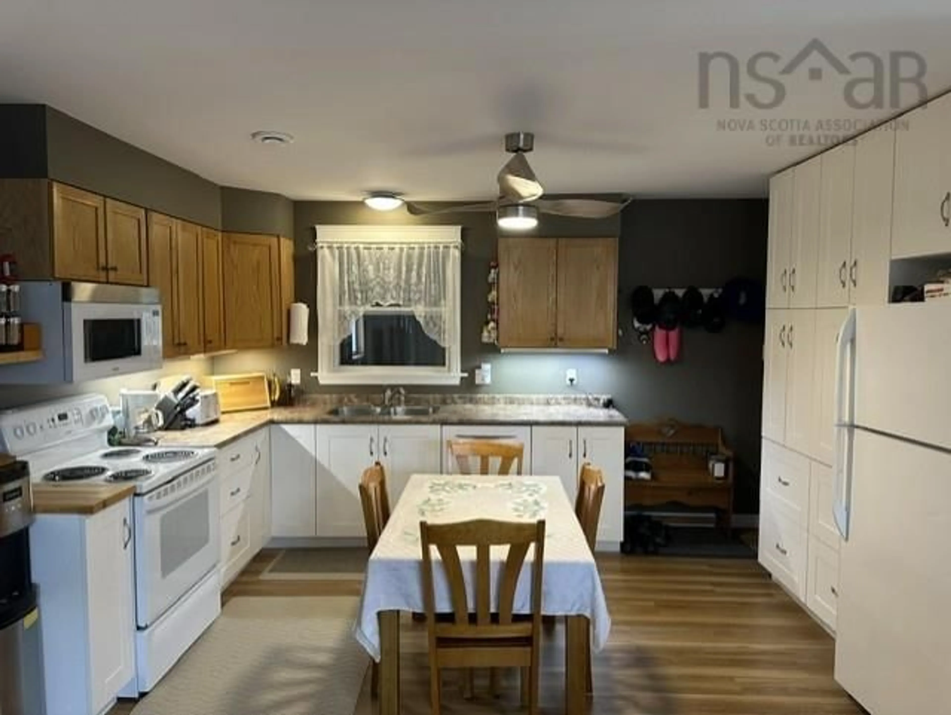 Open concept kitchen, wood/laminate floor for 2064 South Main St, Westville Nova Scotia B0K 2A0