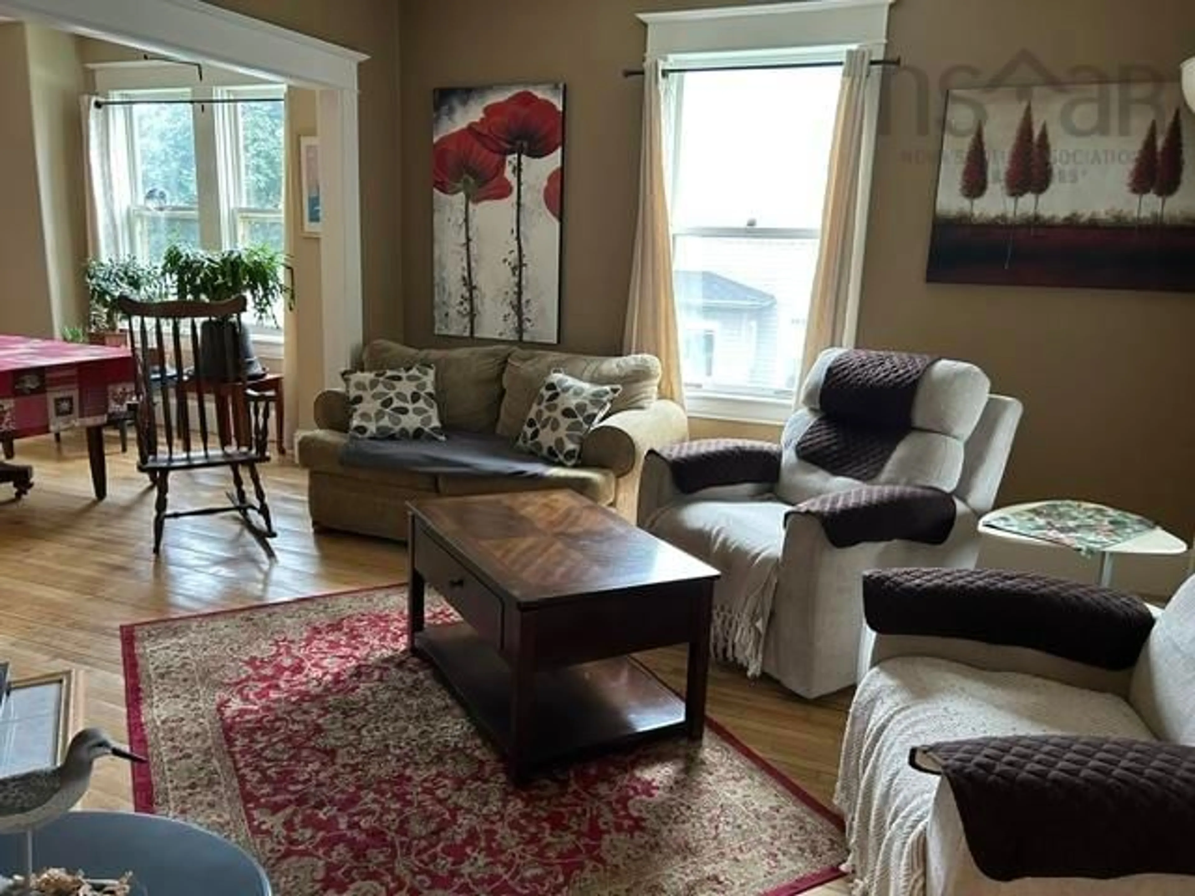 Living room with furniture, wood/laminate floor for 26 Pitt St, Port Hawkesbury Nova Scotia B9A 2T3