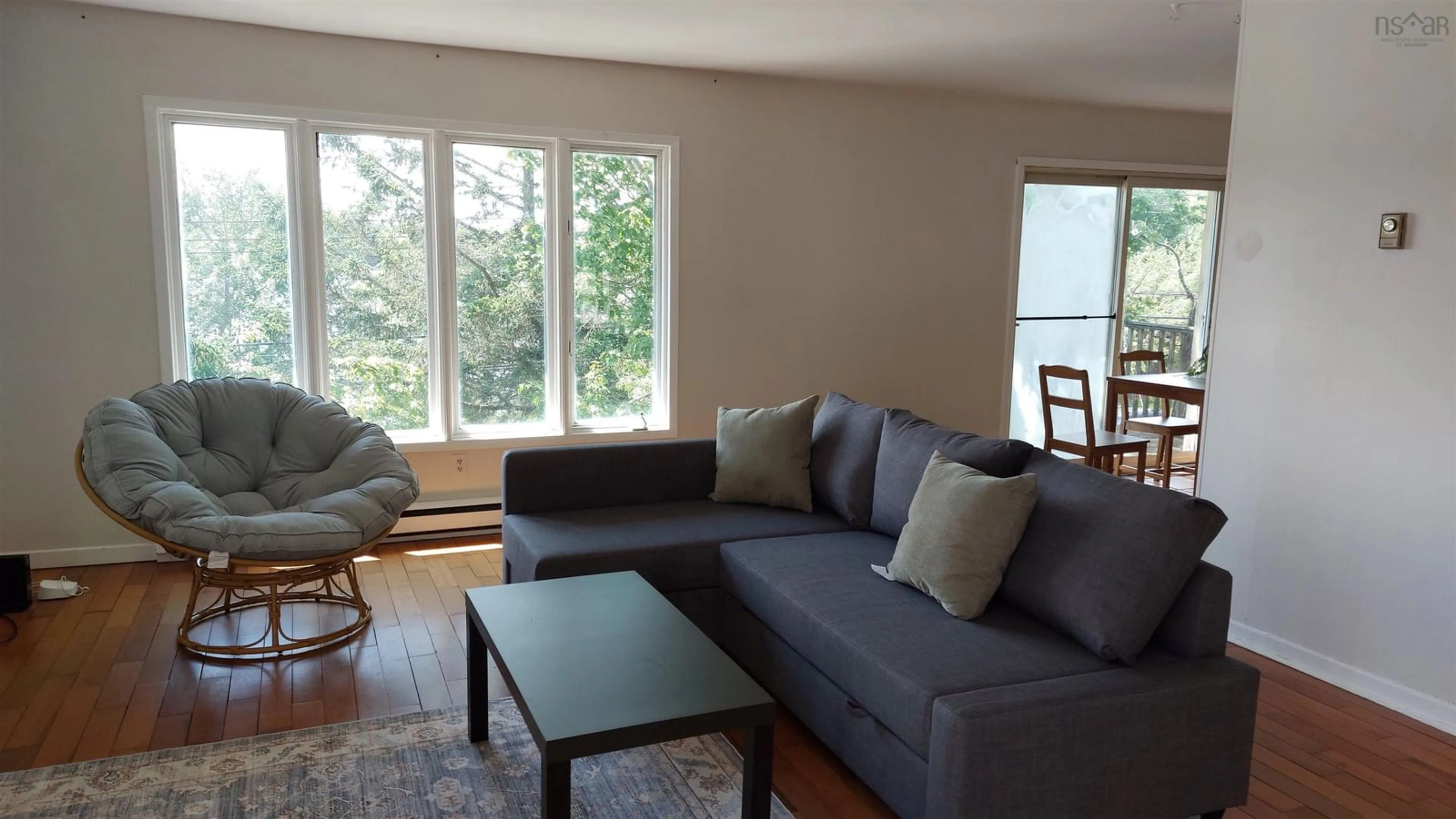 Living room with furniture, wood/laminate floor for 94 Old Sambro Rd, Spryfield Nova Scotia B3R 1R4