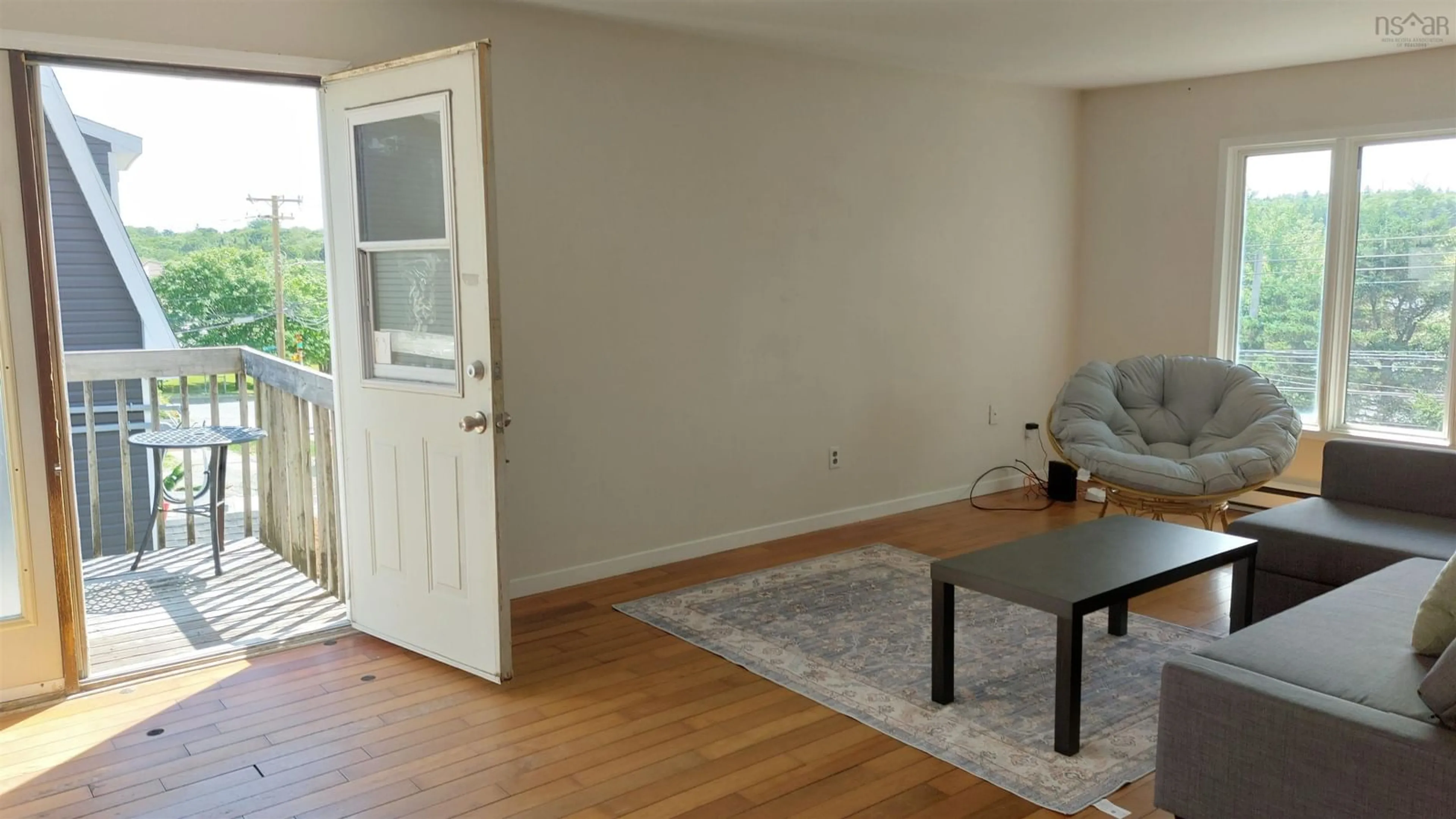 Living room with furniture, wood/laminate floor for 94 Old Sambro Rd, Spryfield Nova Scotia B3R 1R4