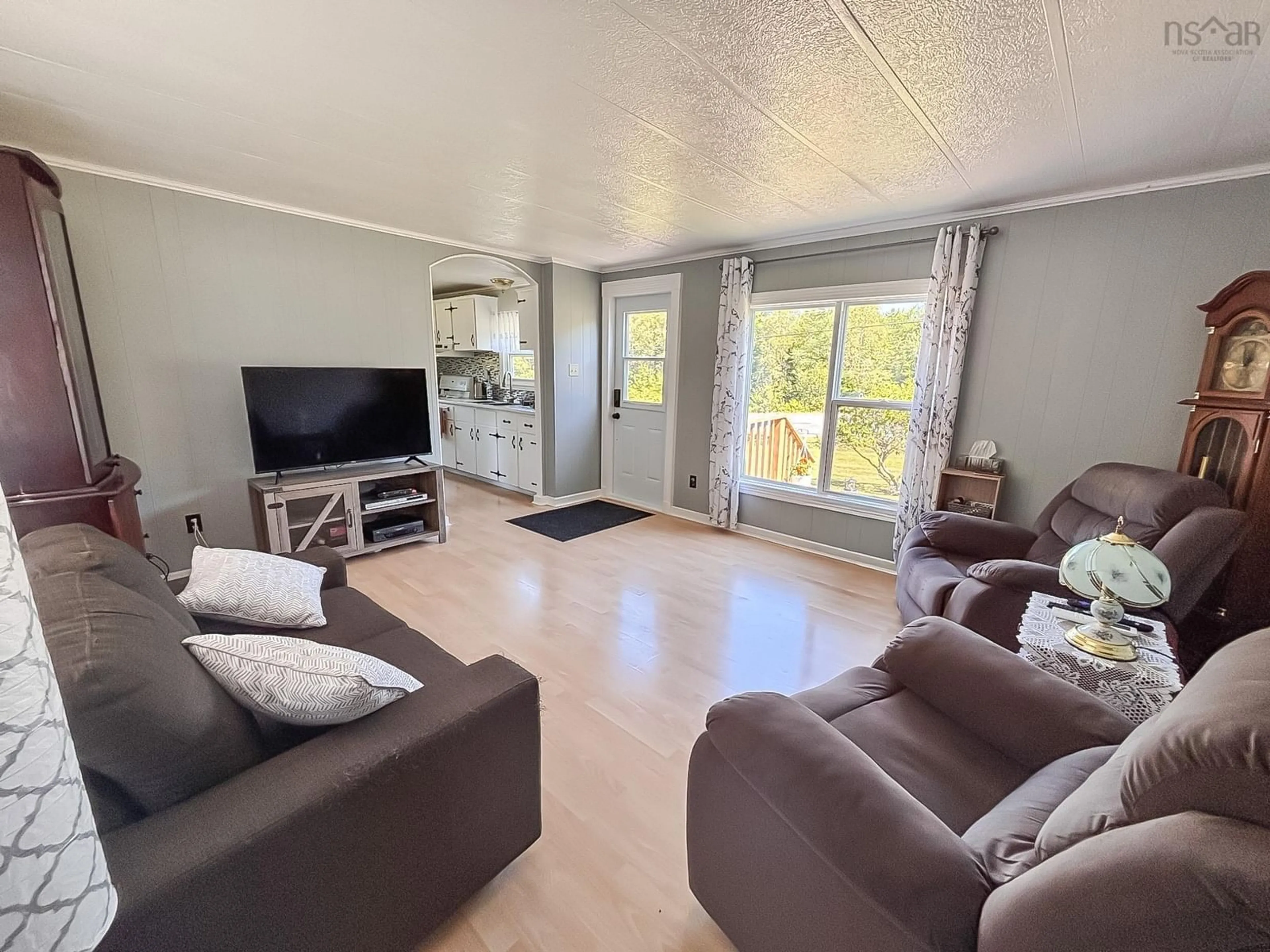 Living room with furniture, wood/laminate floor for 1388 New Cumberland Rd, Lake Centre Nova Scotia B0R 1G0