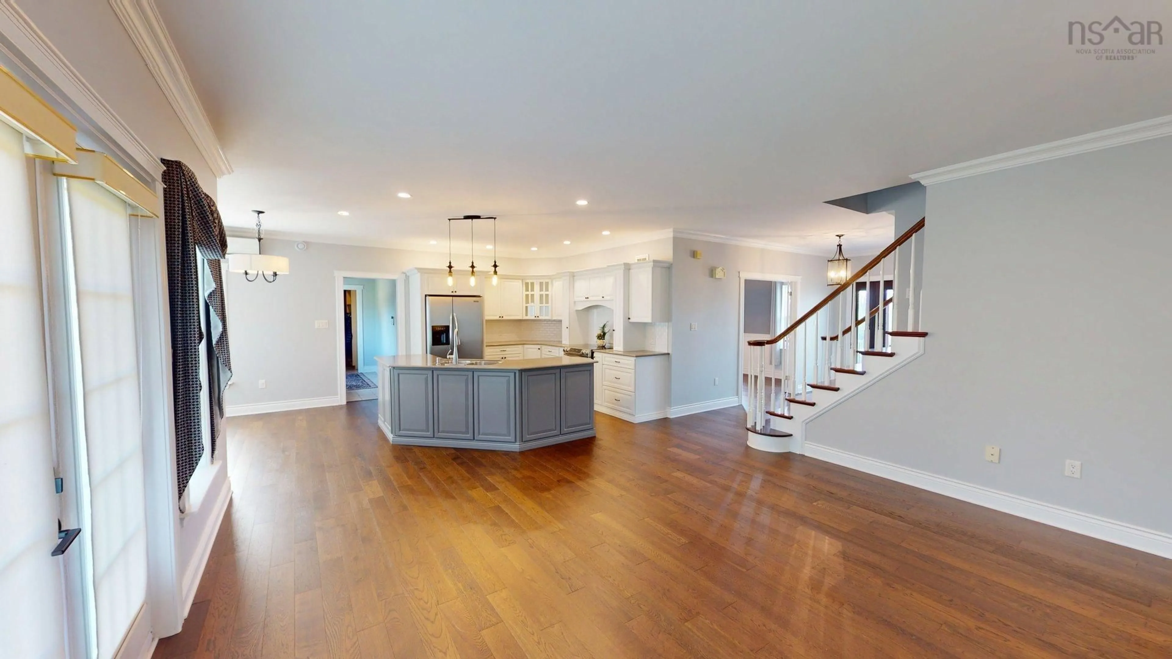 Open concept kitchen, wood/laminate floor for 29 Bedwin Drive, Georges River Nova Scotia B1Y 0A3
