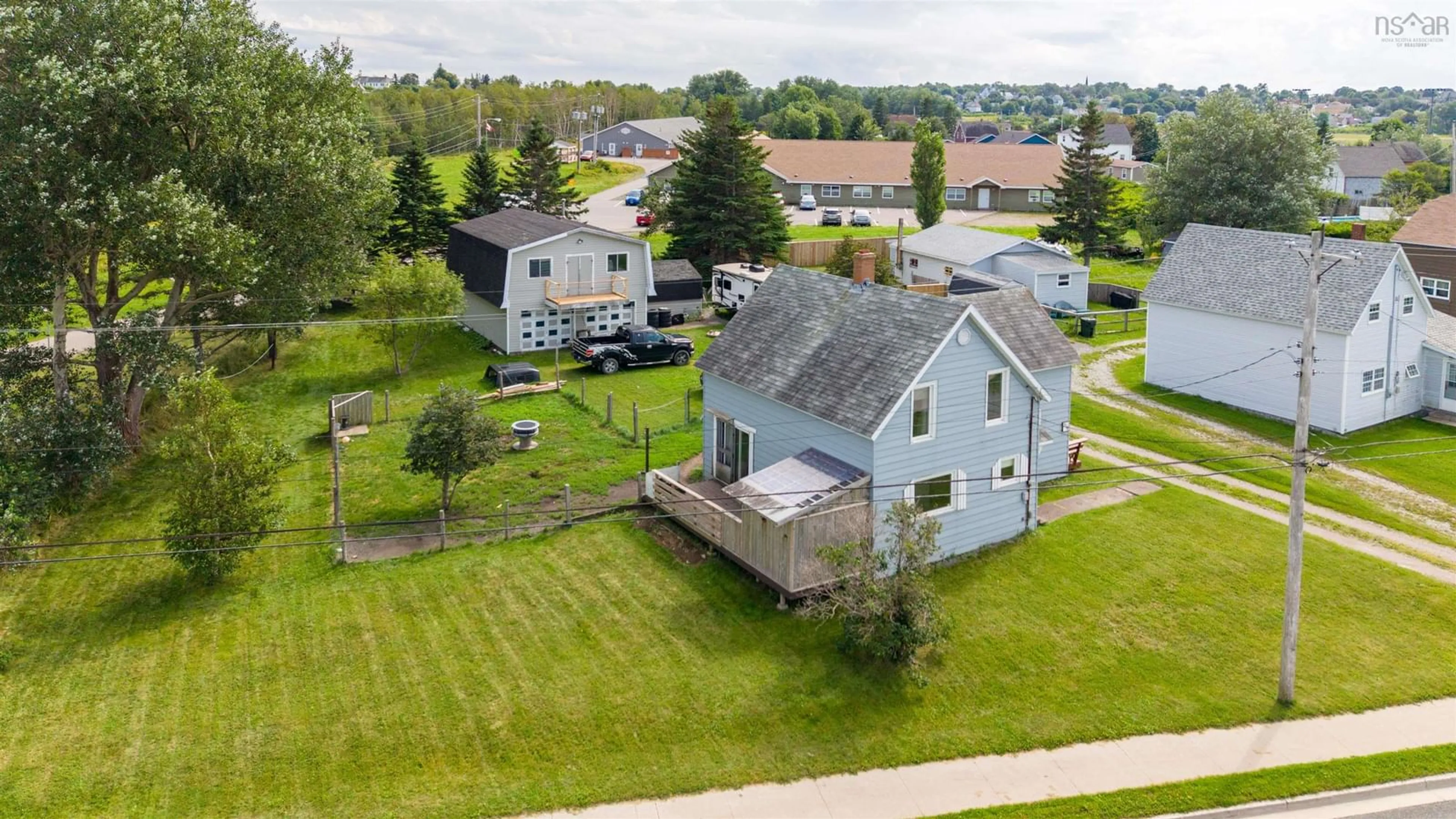 A pic from outside/outdoor area/front of a property/back of a property/a pic from drone, unknown for 218 Pitt St, Sydney Mines Nova Scotia B1V 1S3