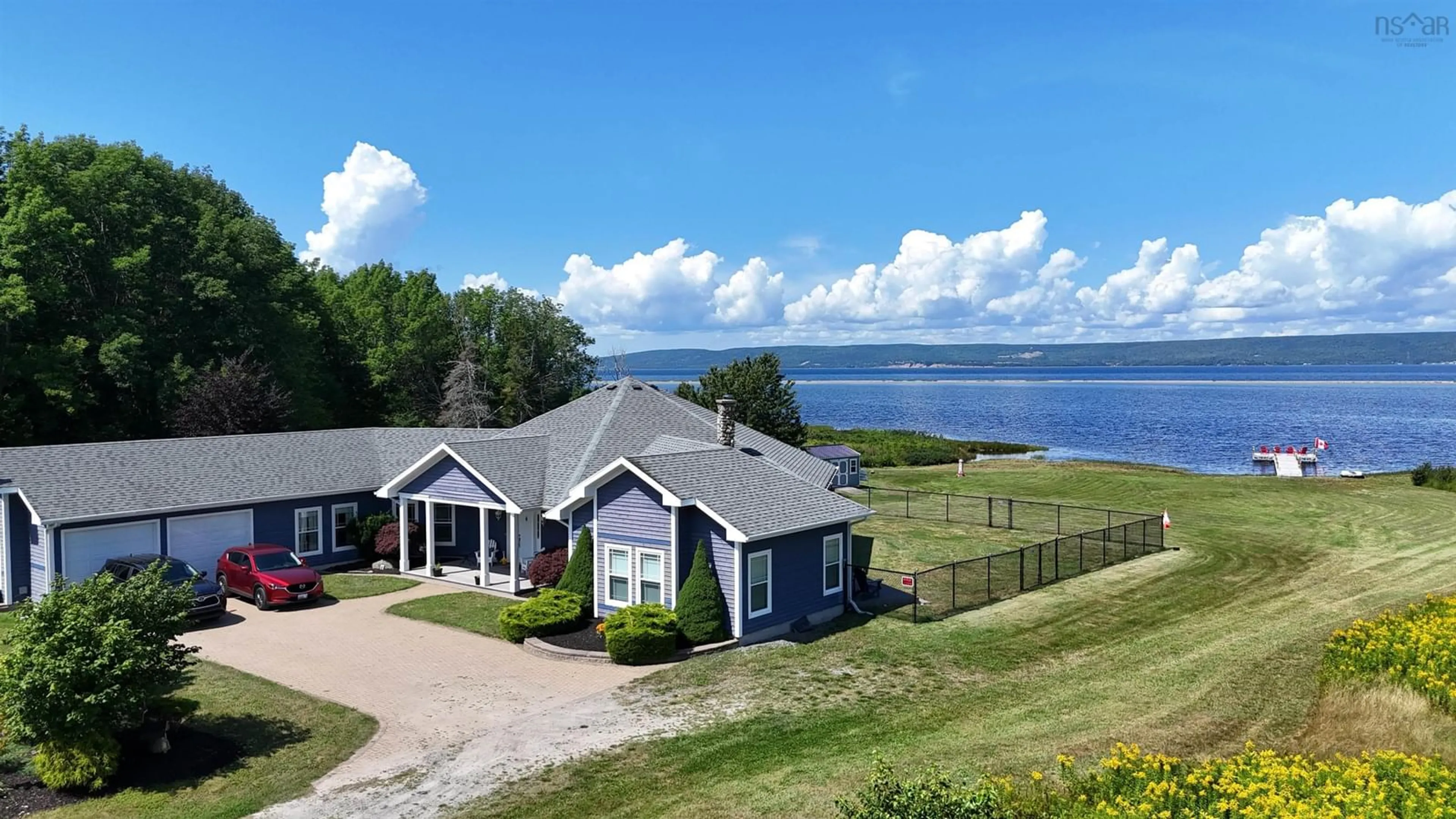 A pic from outside/outdoor area/front of a property/back of a property/a pic from drone, water/lake/river/ocean view for 7914 East Bay Hwy, Big Pond Centre Nova Scotia B1J 1Z5