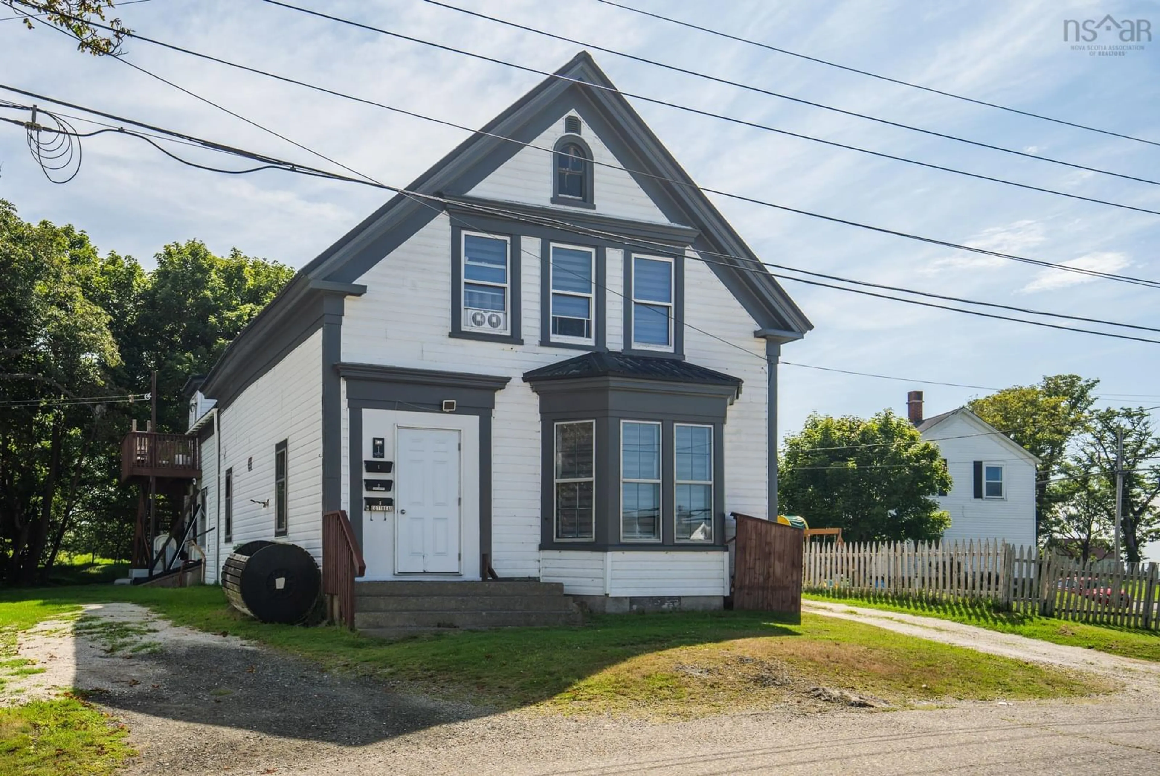 Home with vinyl exterior material, street for 1 Butler St, Yarmouth Nova Scotia B5A 3Y7