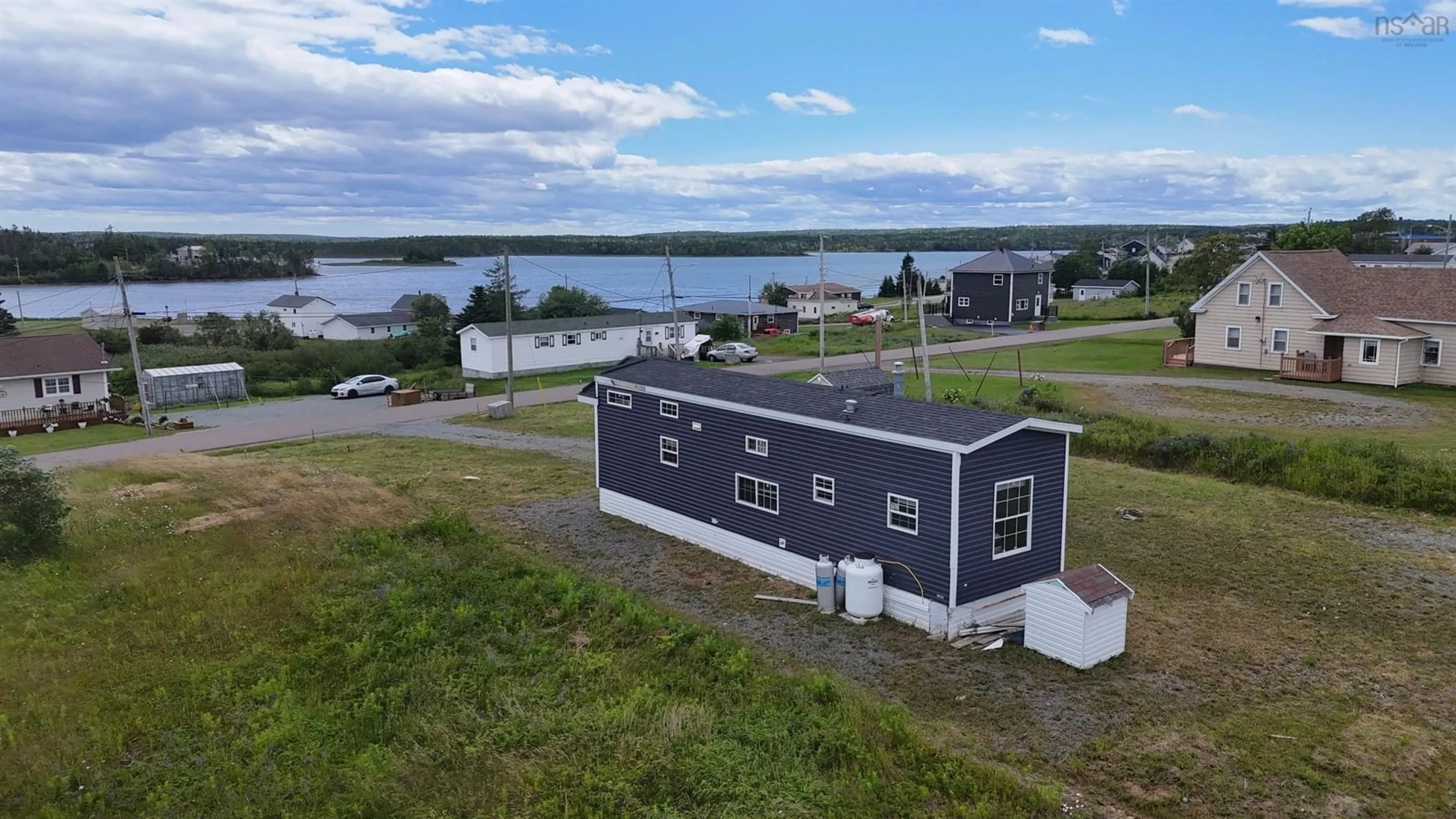 A pic from outside/outdoor area/front of a property/back of a property/a pic from drone, water/lake/river/ocean view for 51 Bennie's Lane, Louisdale Nova Scotia B0E 1V0