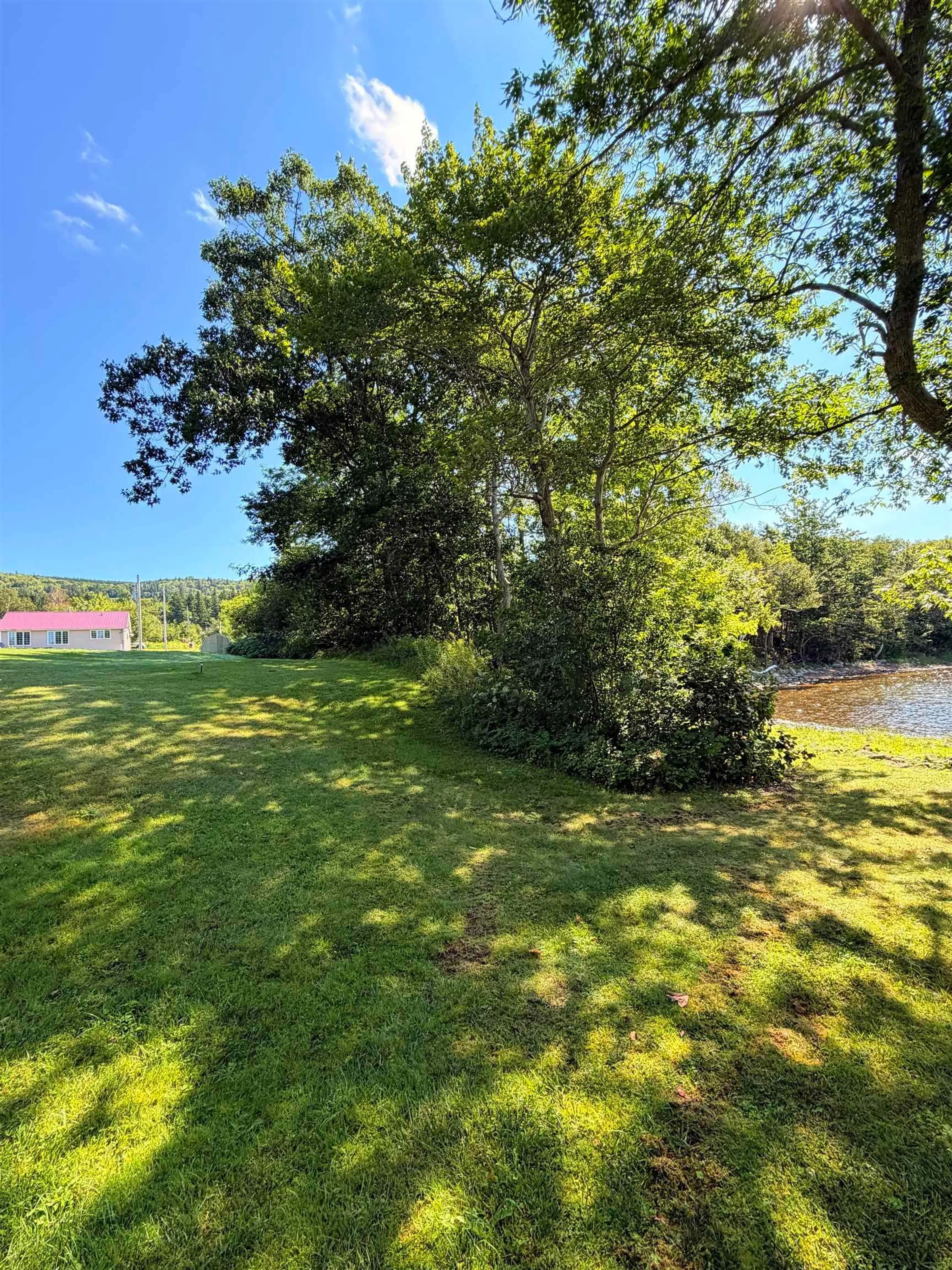 A pic from outside/outdoor area/front of a property/back of a property/a pic from drone, water/lake/river/ocean view for 2941 Highway 395 #395, East Lake Ainslie Nova Scotia B0E 3M0