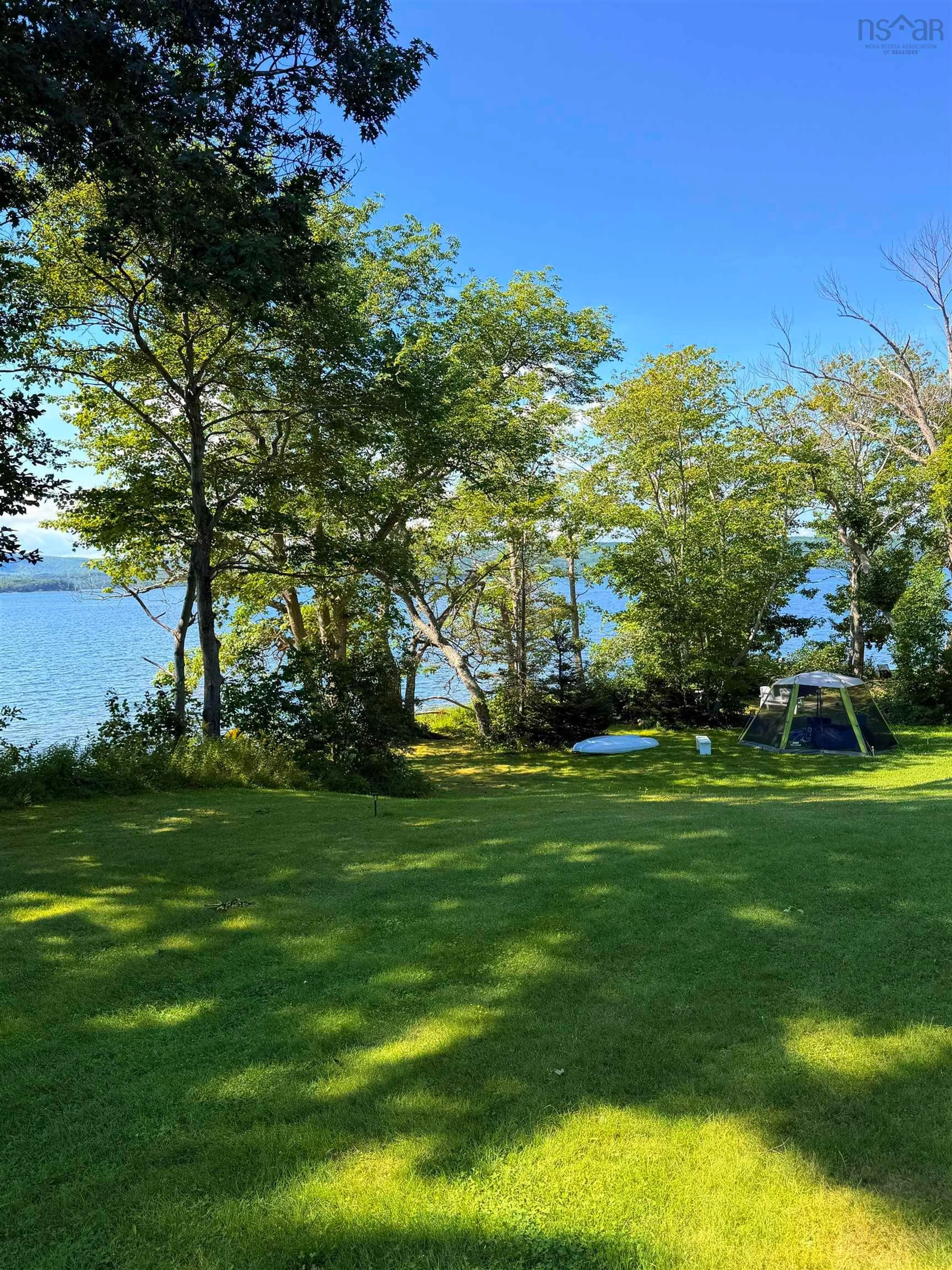 A pic from outside/outdoor area/front of a property/back of a property/a pic from drone, water/lake/river/ocean view for 2941 Highway 395 #395, East Lake Ainslie Nova Scotia B0E 3M0