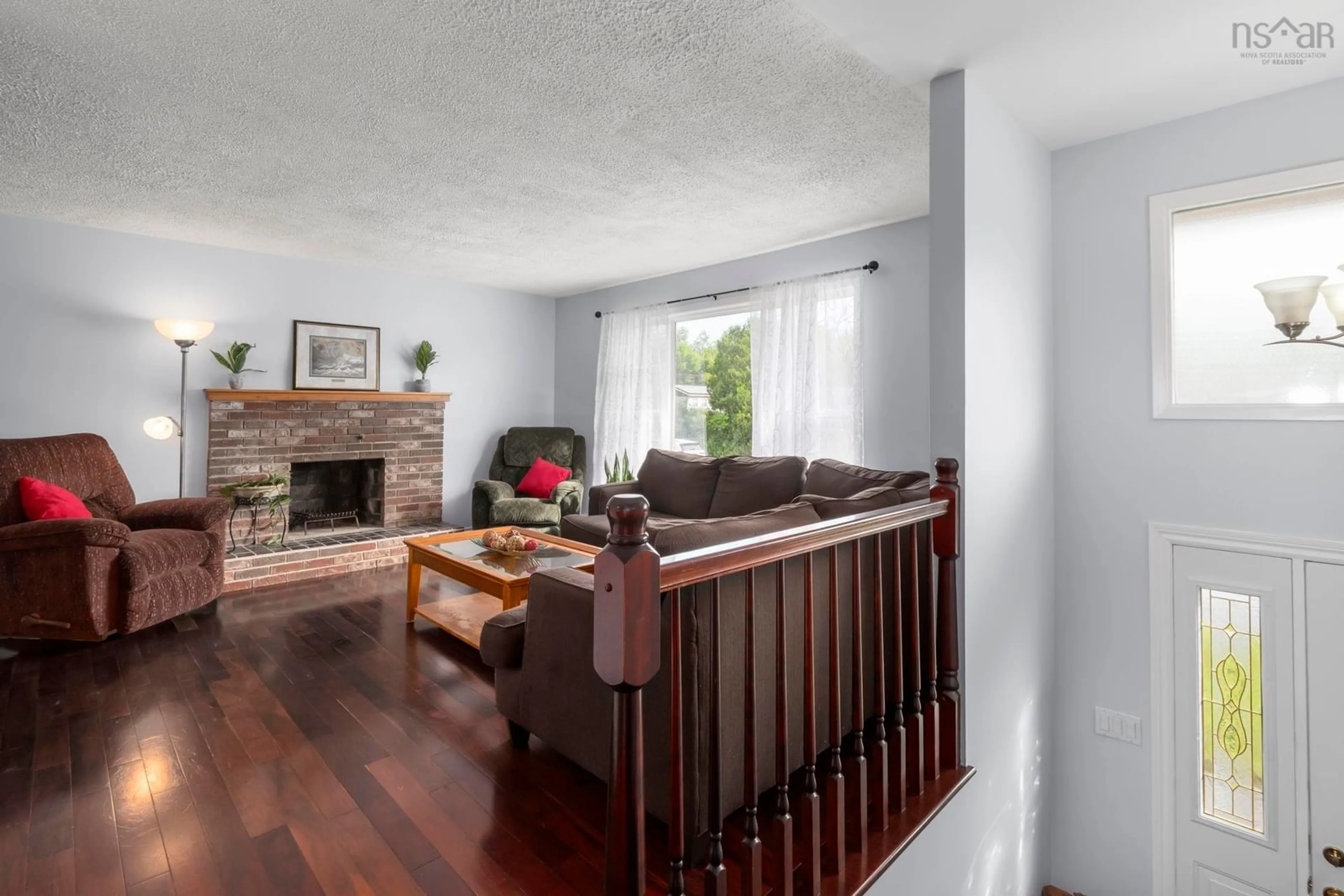 Living room with furniture, wood/laminate floor for 179 Sampson Drive, Lower Sackville Nova Scotia B4C 2V9