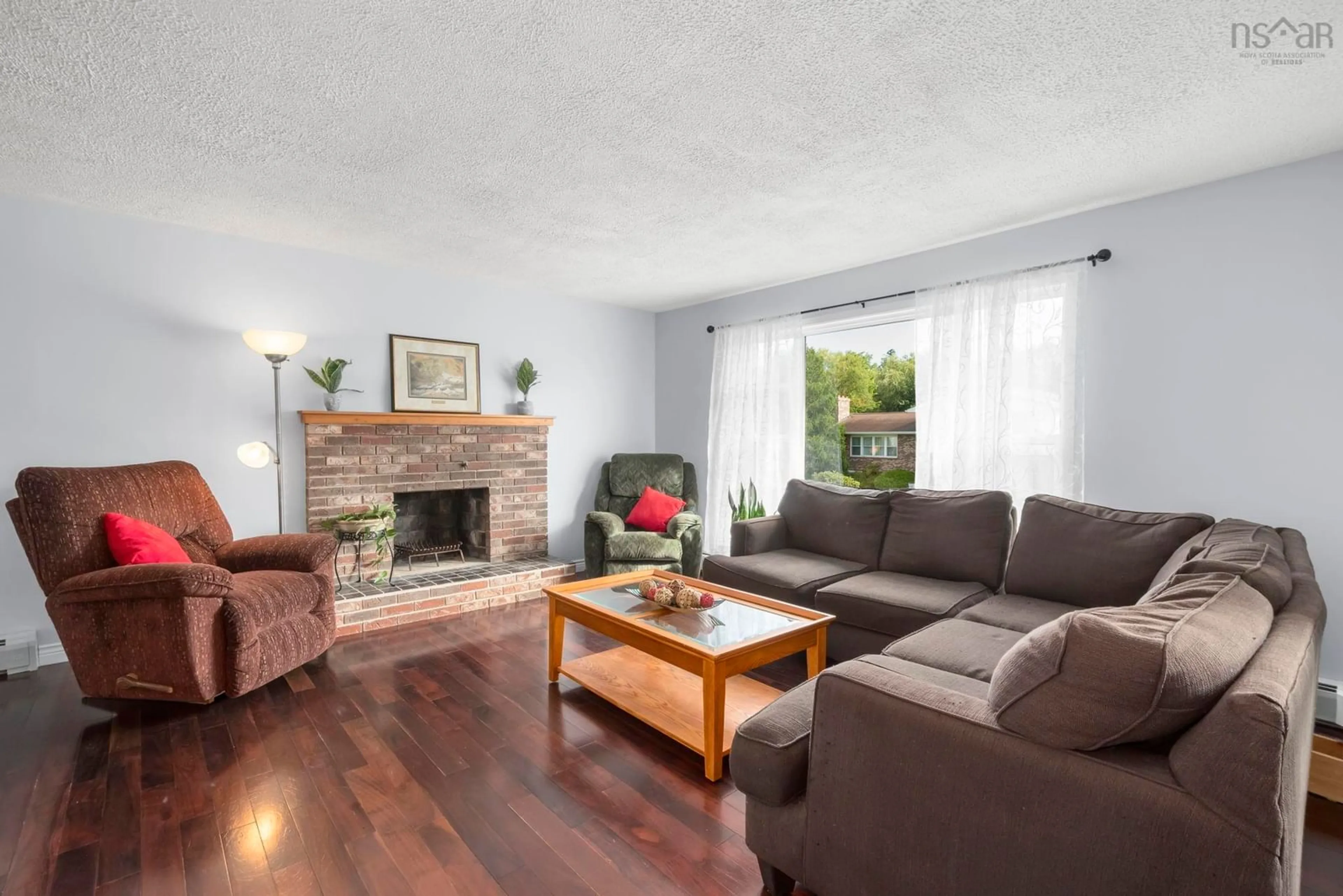 Living room with furniture, wood/laminate floor for 179 Sampson Drive, Lower Sackville Nova Scotia B4C 2V9