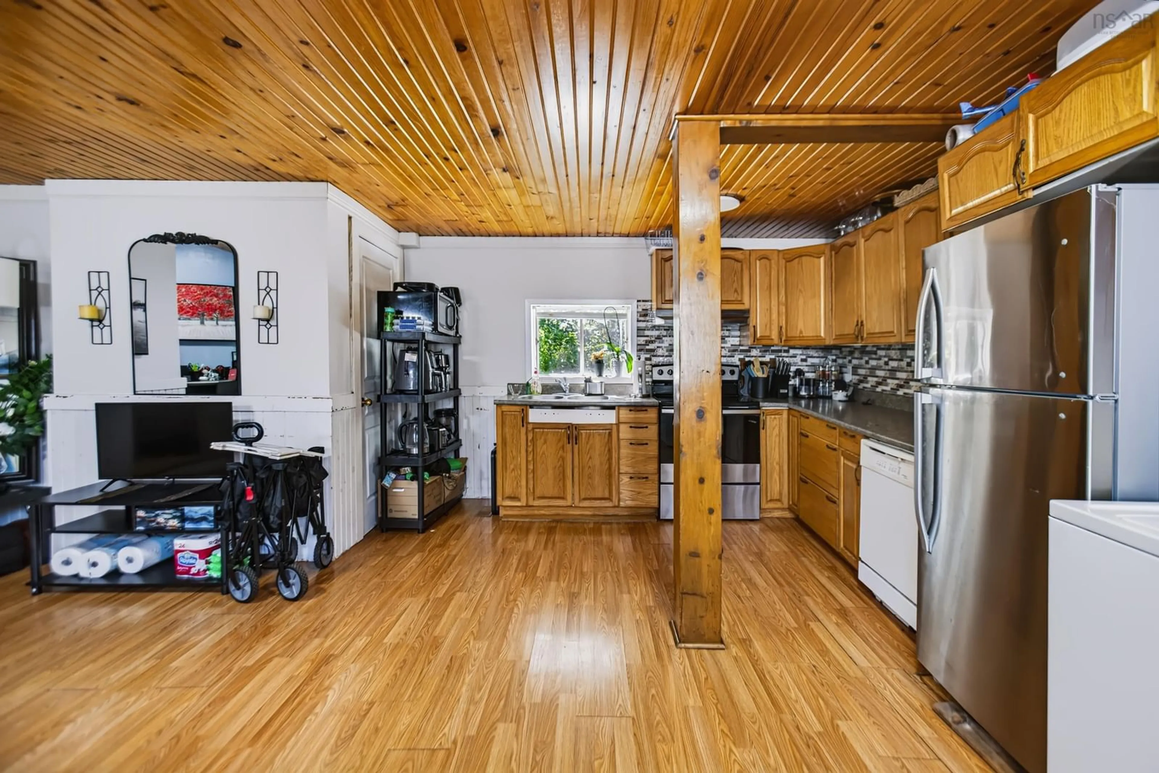 Open concept kitchen, wood/laminate floor for 21 West Victoria St, Amherst Nova Scotia B4H 1B9