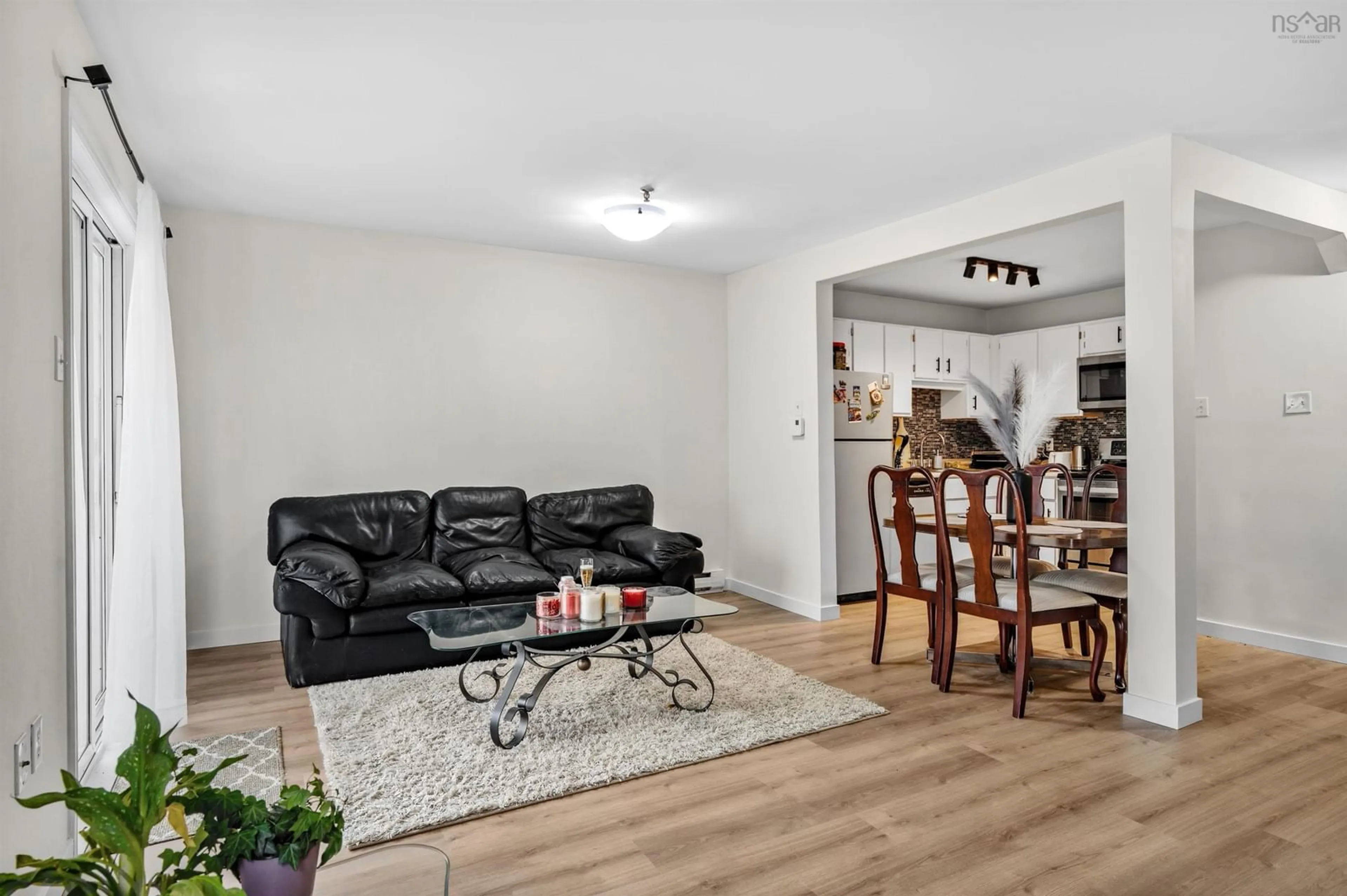 Living room with furniture, wood/laminate floor for 75 Collins Grove #101, Dartmouth Nova Scotia B2W 6B3