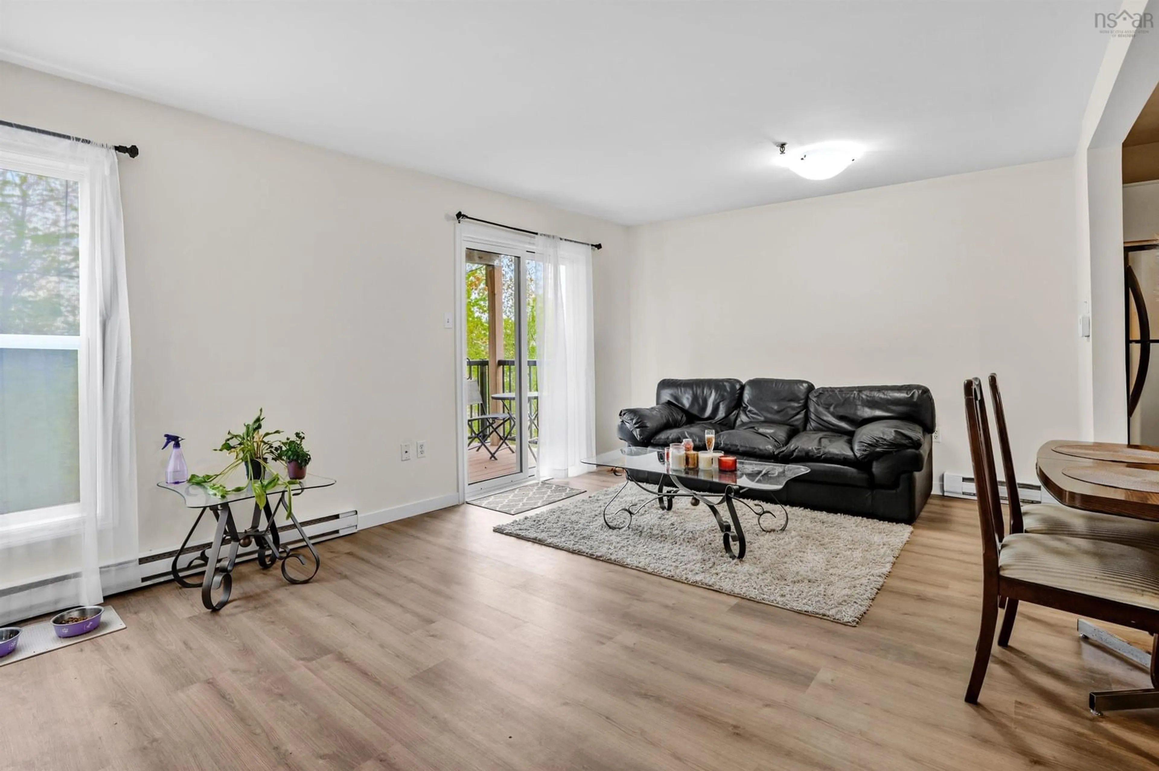 Living room with furniture, wood/laminate floor for 75 Collins Grove #101, Dartmouth Nova Scotia B2W 6B3