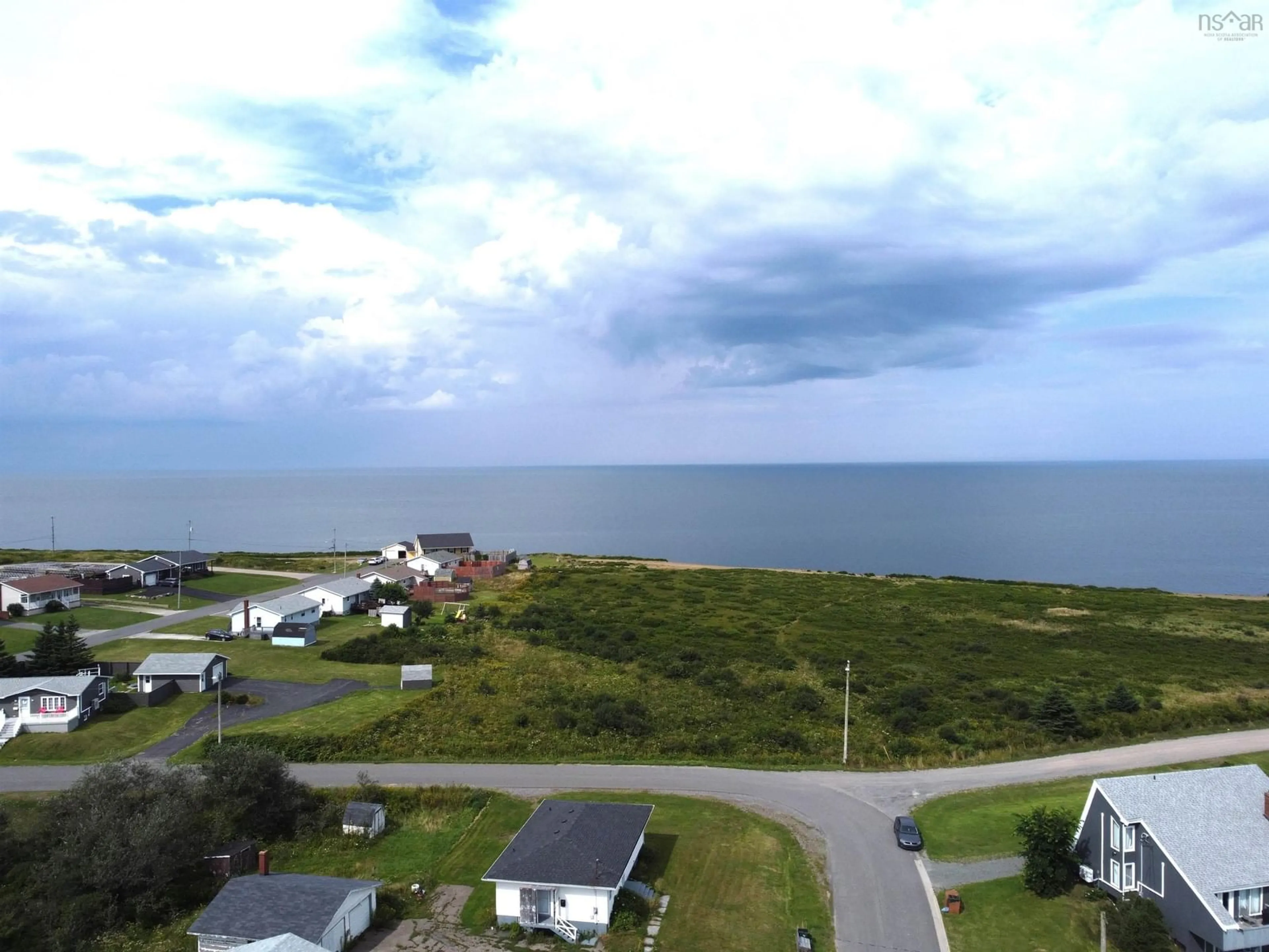 A pic from outside/outdoor area/front of a property/back of a property/a pic from drone, water/lake/river/ocean view for 218 Waterview St, New Waterford Nova Scotia B1H 3G4