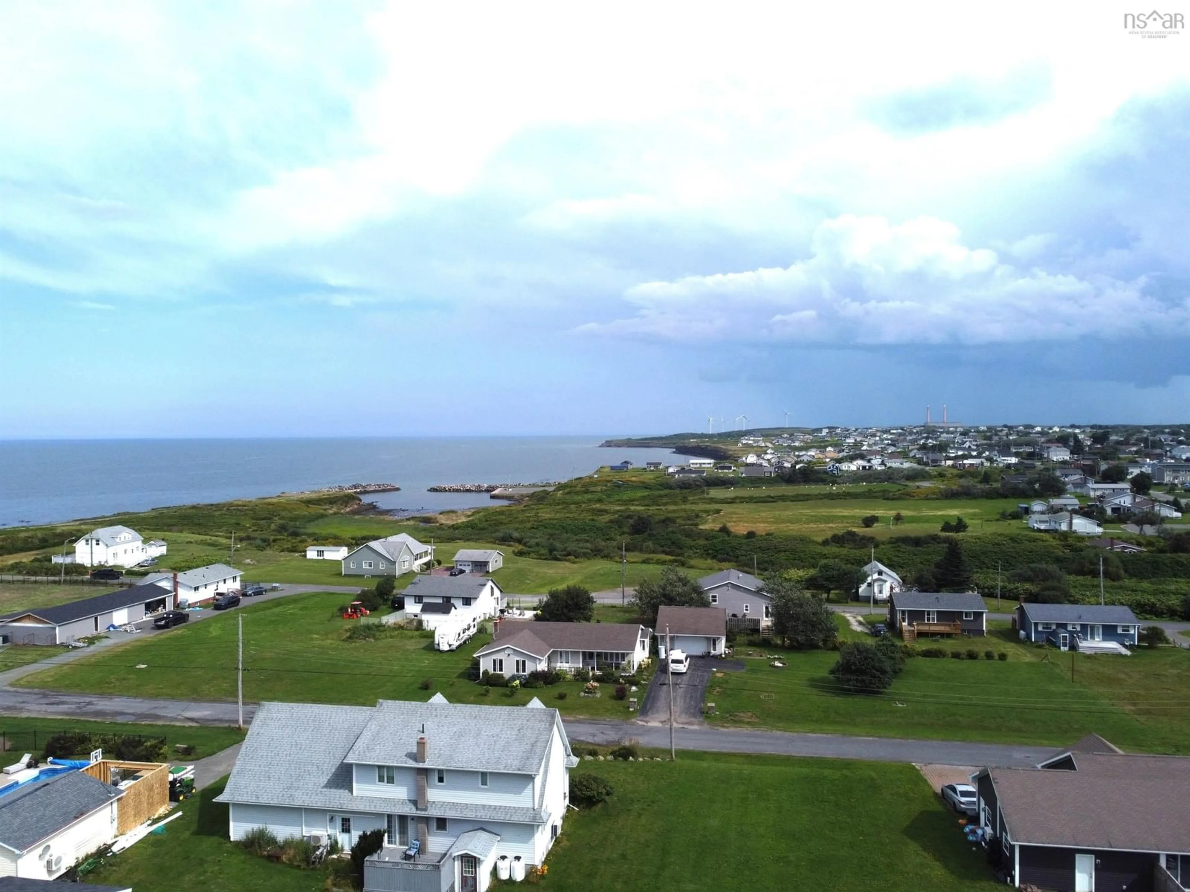 A pic from outside/outdoor area/front of a property/back of a property/a pic from drone, water/lake/river/ocean view for 218 Waterview St, New Waterford Nova Scotia B1H 3G4
