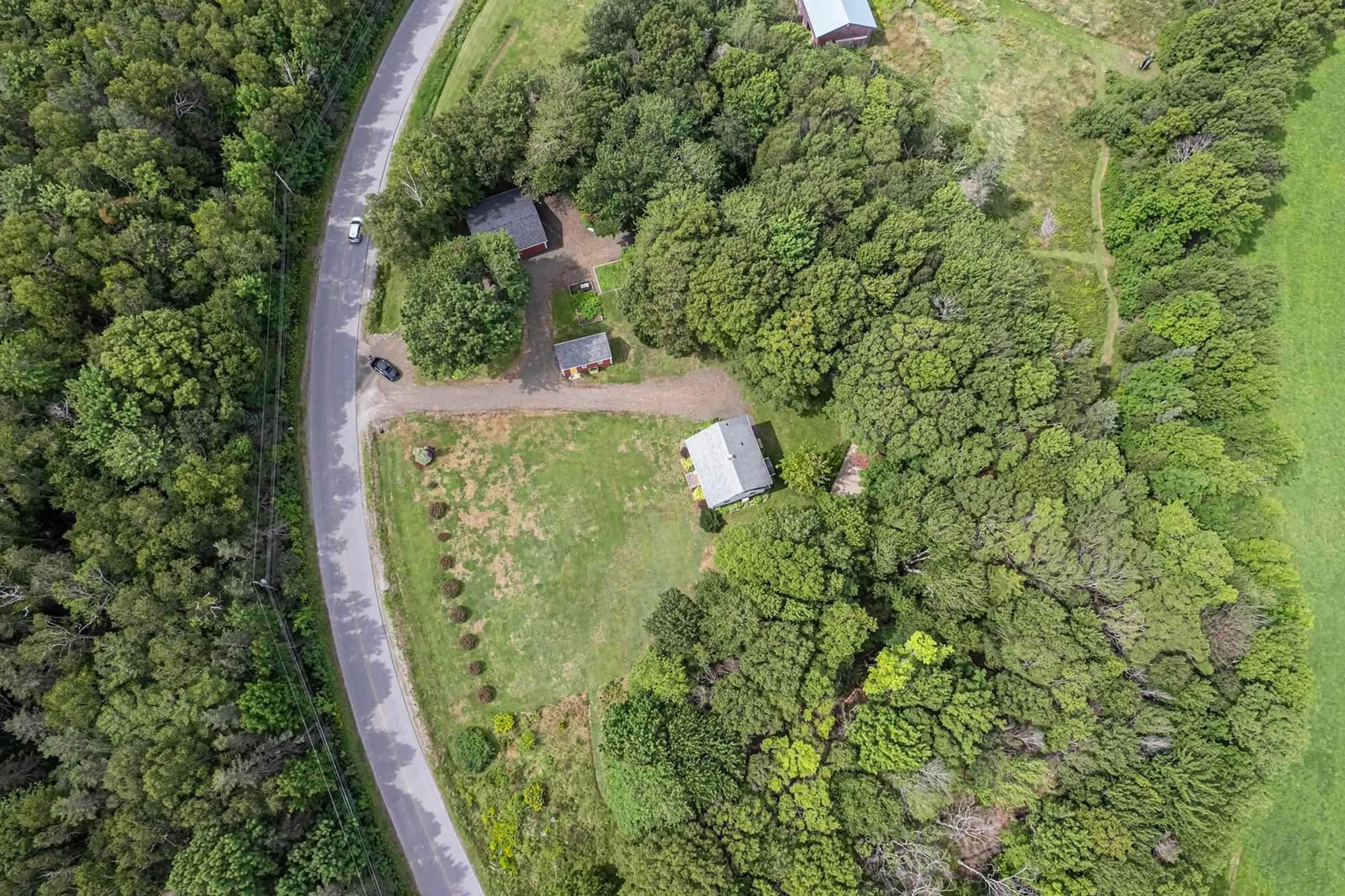 A pic from outside/outdoor area/front of a property/back of a property/a pic from drone, forest/trees view for 12791 Shore Rd, Moshers Corner Nova Scotia B0S 1P0