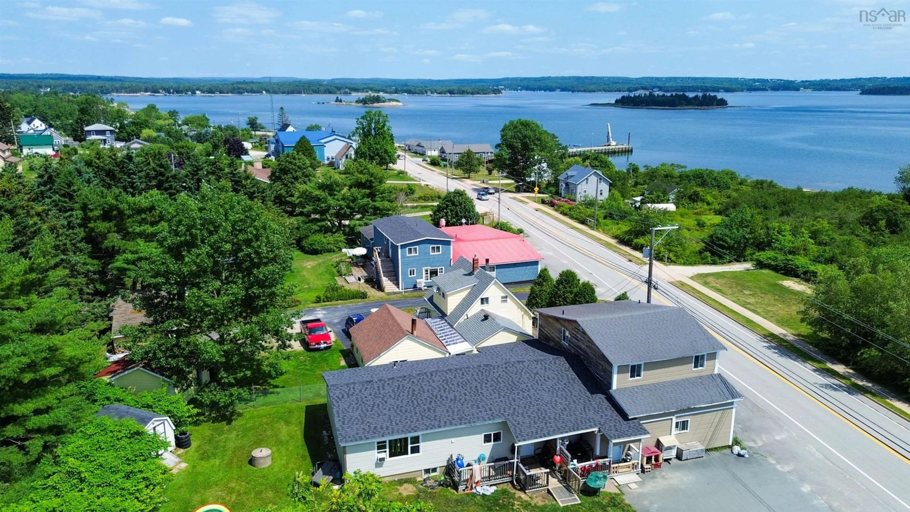 A pic from outside/outdoor area/front of a property/back of a property/a pic from drone, water/lake/river/ocean view for 6452 Highway 3, Western Shore Nova Scotia B0J 3M0