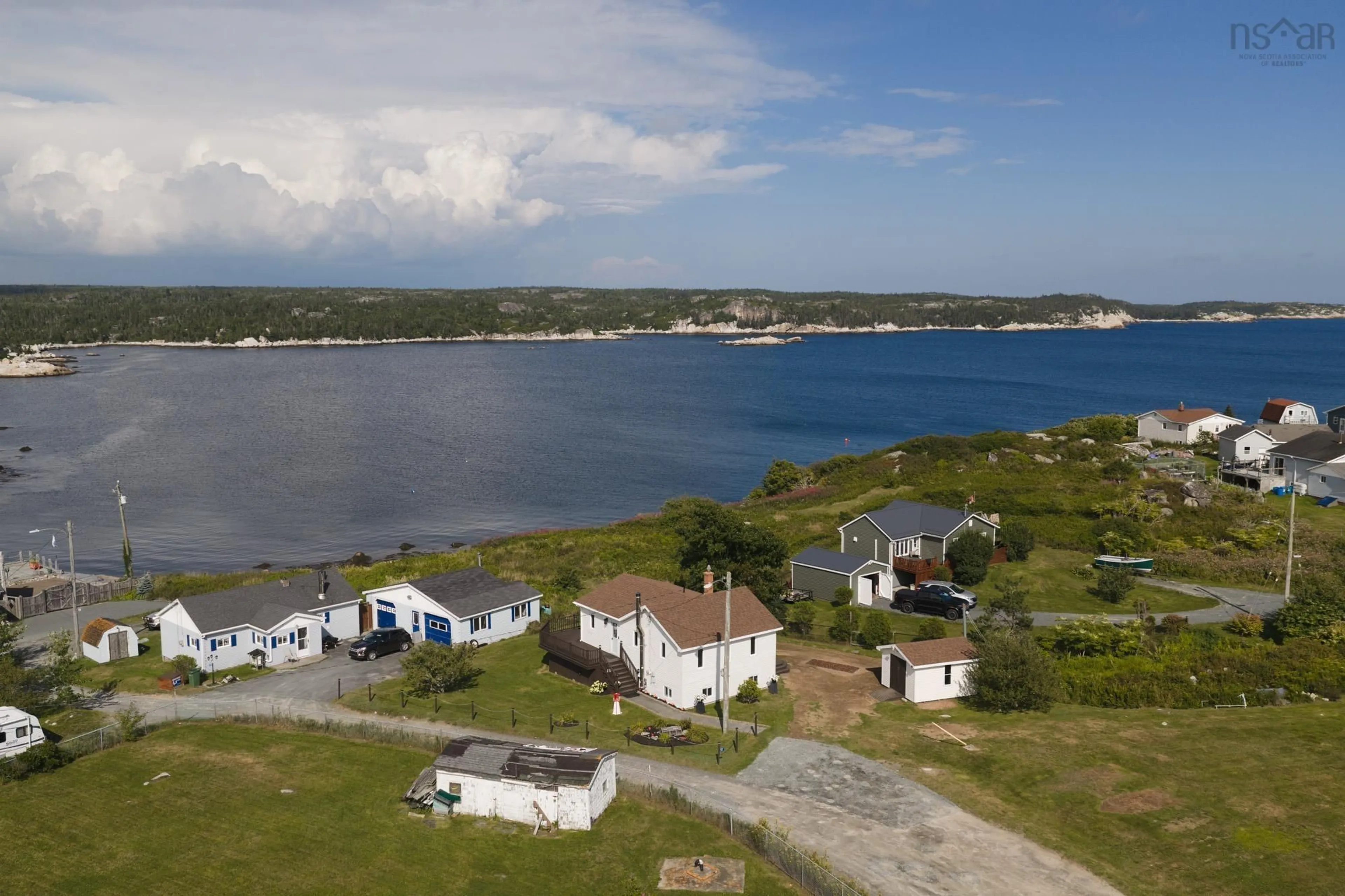 A pic from outside/outdoor area/front of a property/back of a property/a pic from drone, water/lake/river/ocean view for 17 Demers Rd, Terence Bay Nova Scotia B3T 1Y2