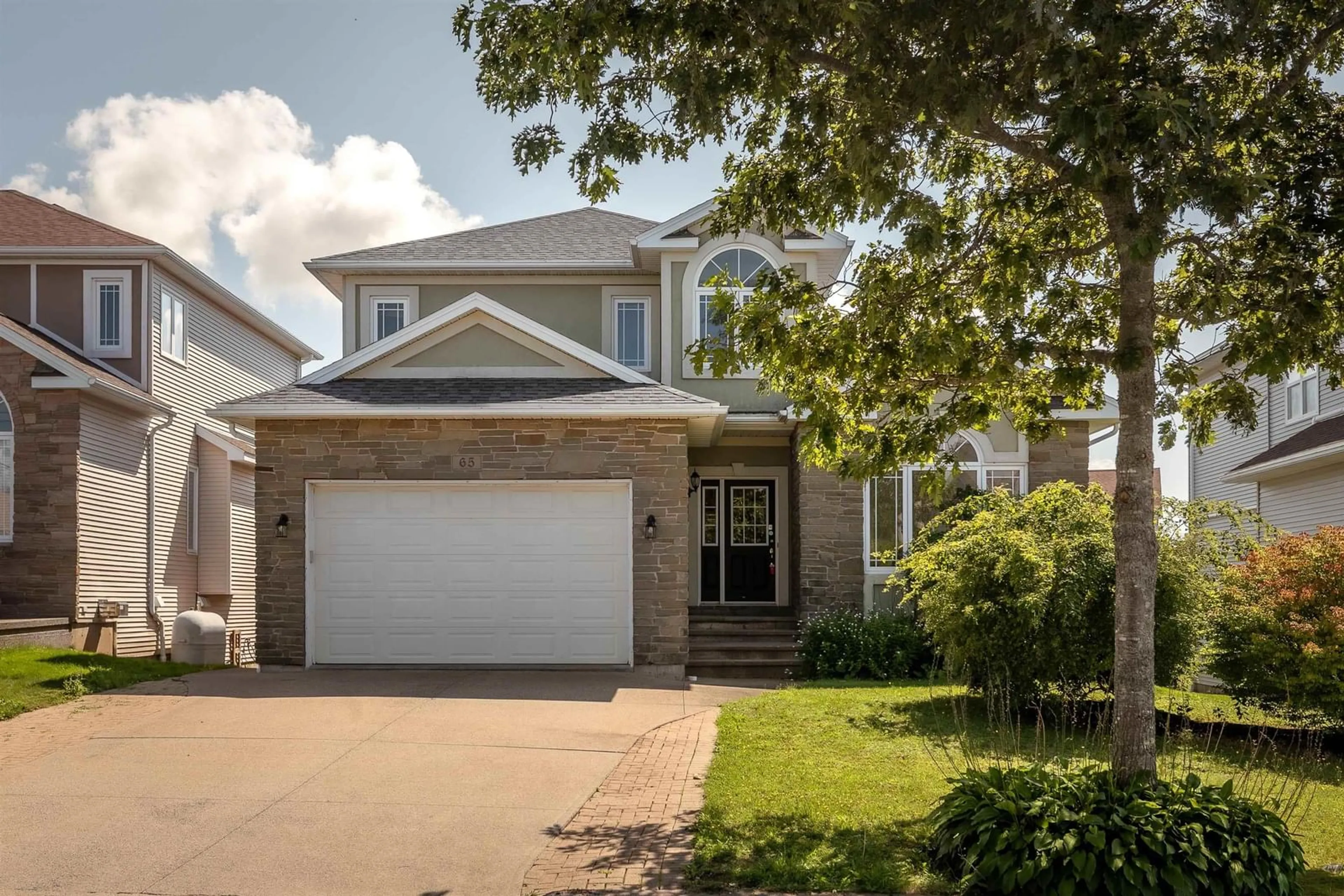 Home with vinyl exterior material, street for 65 Stone Gate Dr, Halifax Nova Scotia B3N 3J3