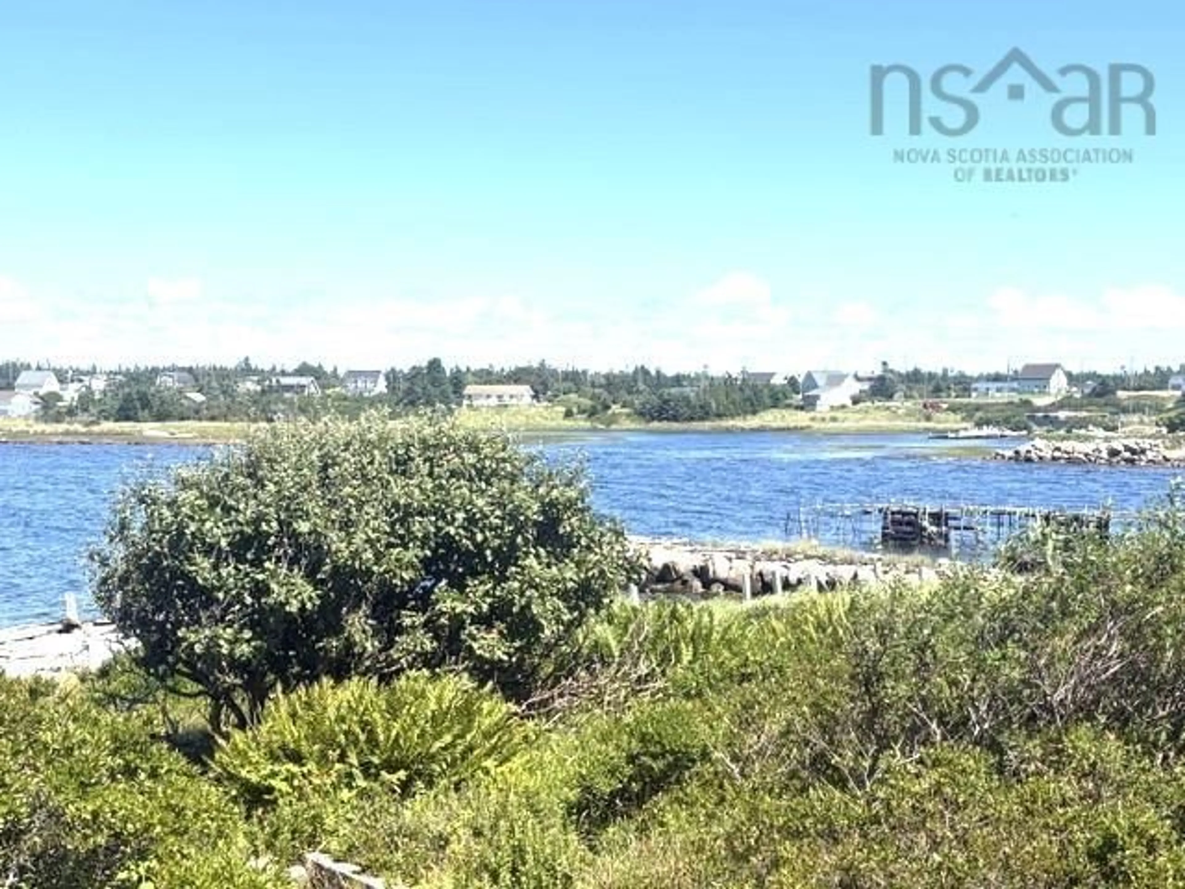 A pic from outside/outdoor area/front of a property/back of a property/a pic from drone, water/lake/river/ocean view for 52 Cecil St, Clark's Harbour Nova Scotia B0W 1P0