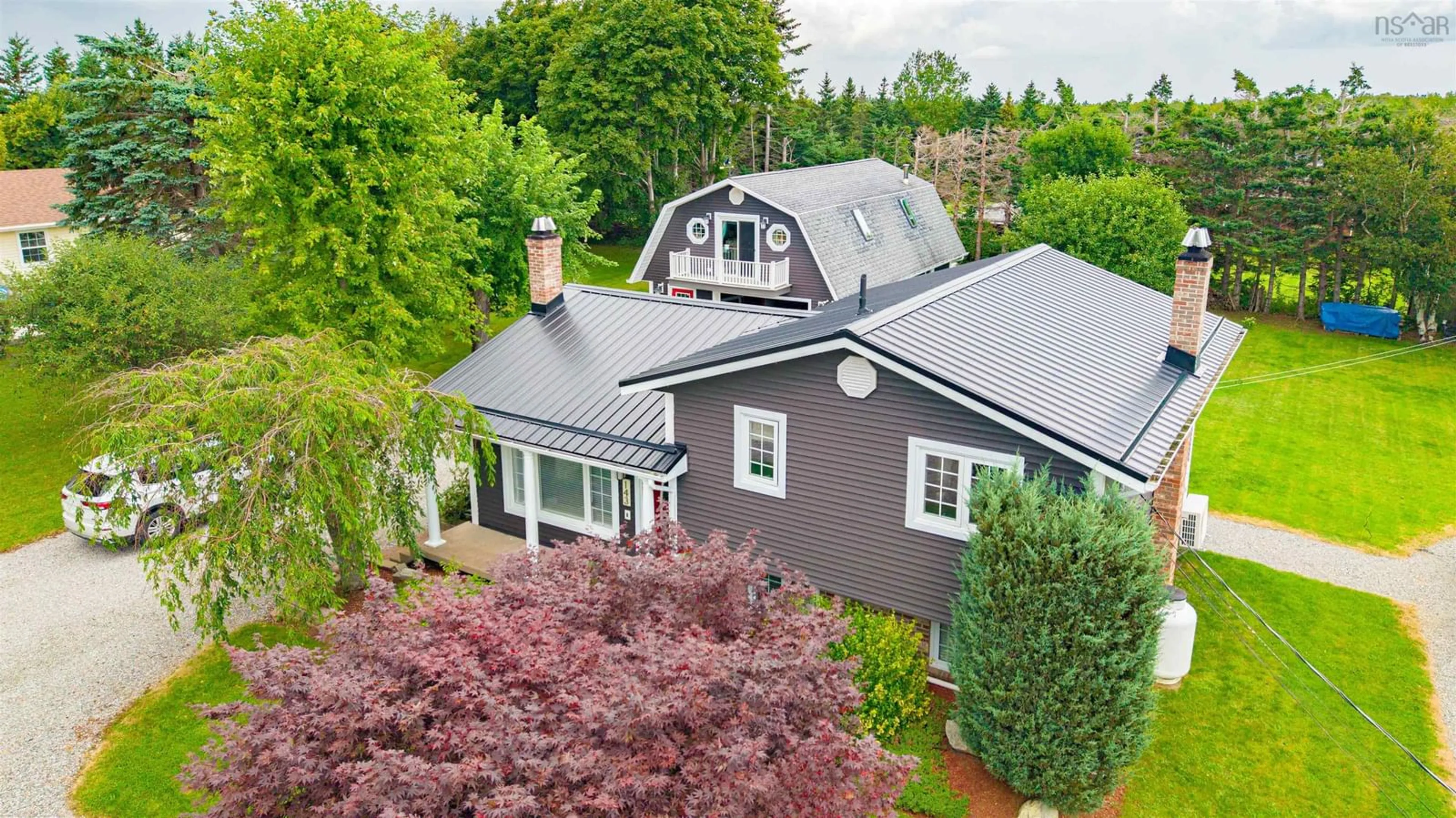 A pic from outside/outdoor area/front of a property/back of a property/a pic from drone, street for 143 Sunrise Dr, Georges River Nova Scotia B1Y 3B6
