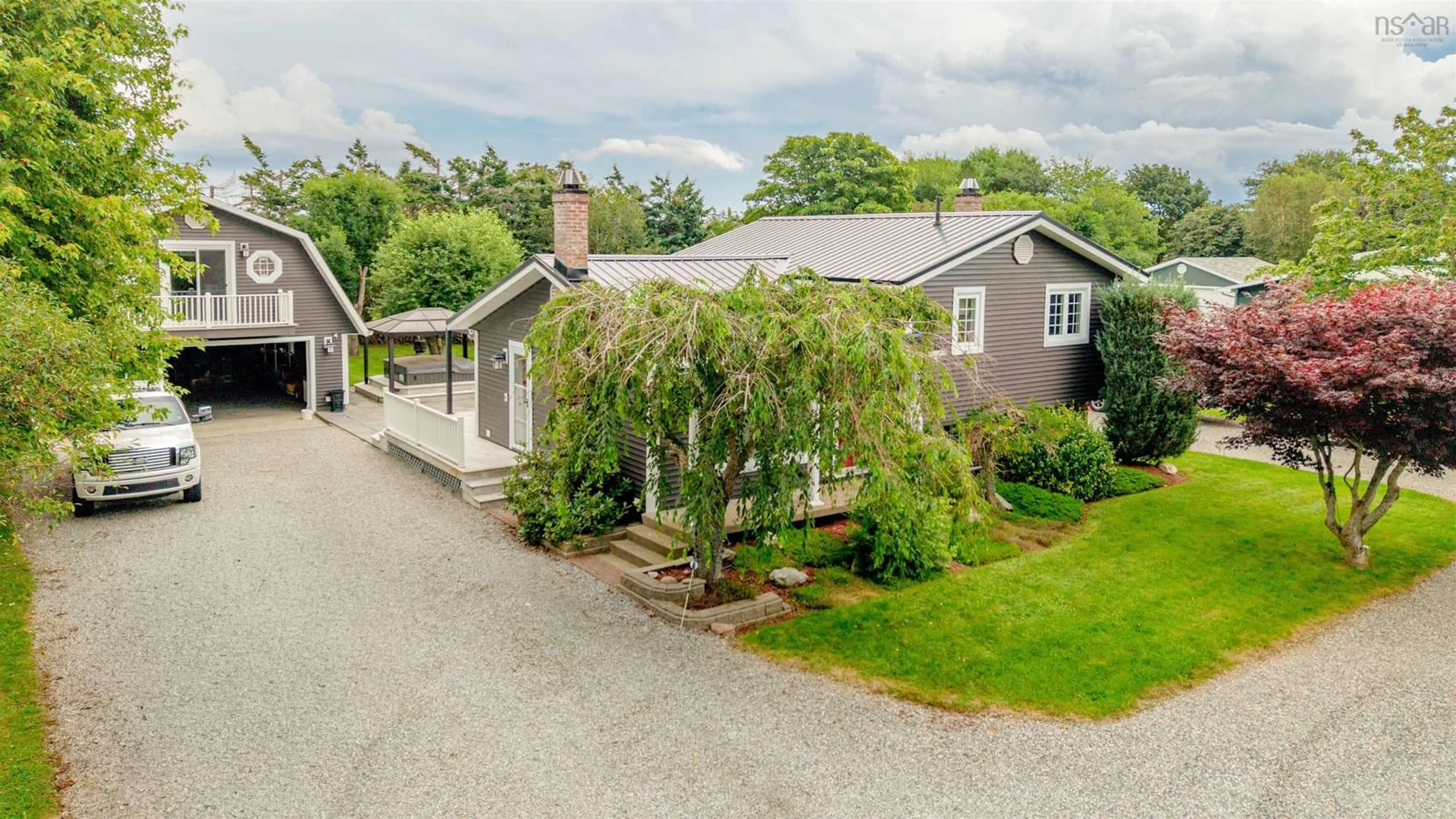 A pic from outside/outdoor area/front of a property/back of a property/a pic from drone, street for 143 Sunrise Dr, Georges River Nova Scotia B1Y 3B6