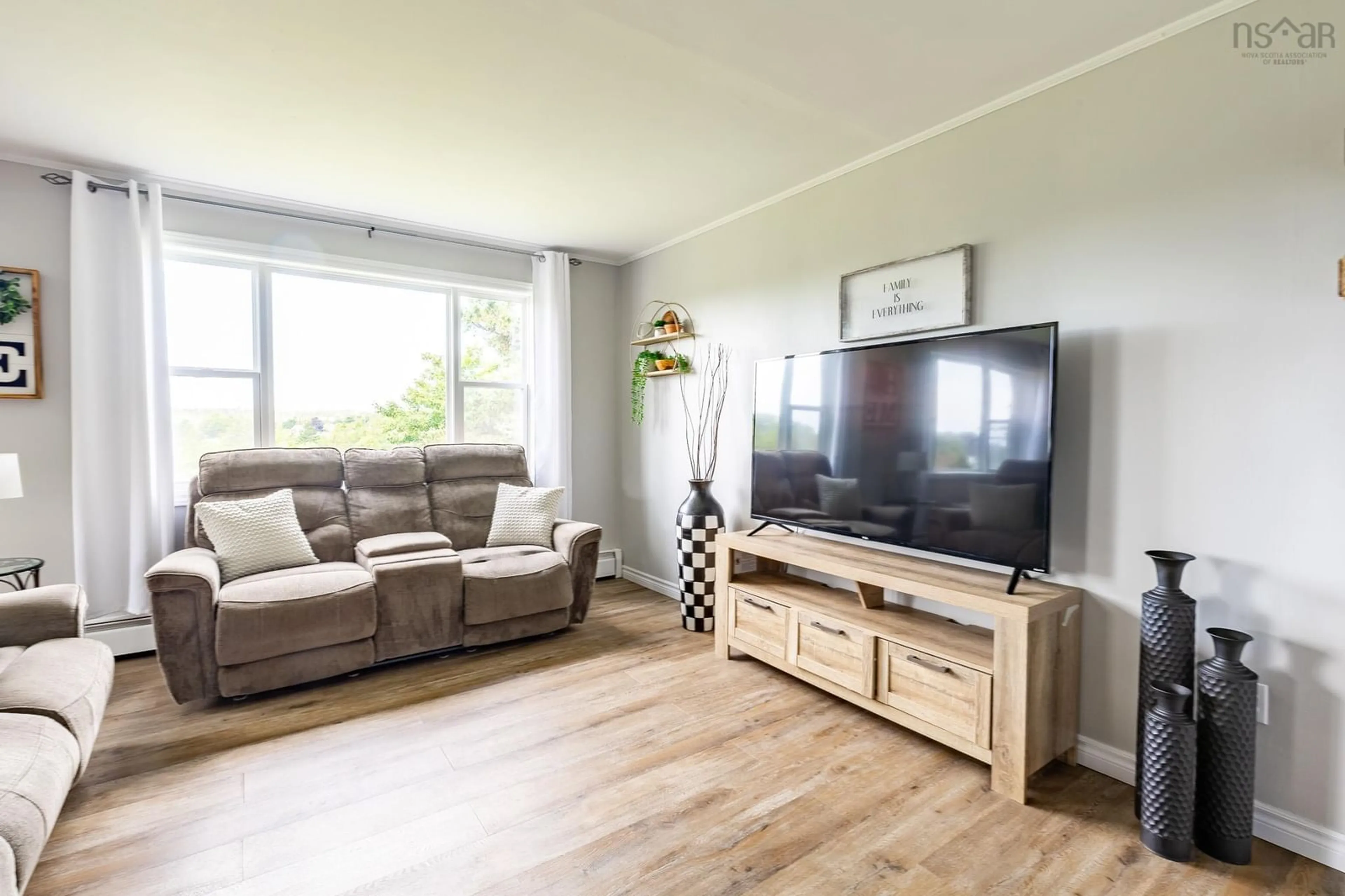 Living room with furniture, wood/laminate floor for 19 Spruce Lane, Hebron Nova Scotia B5A 5Z6
