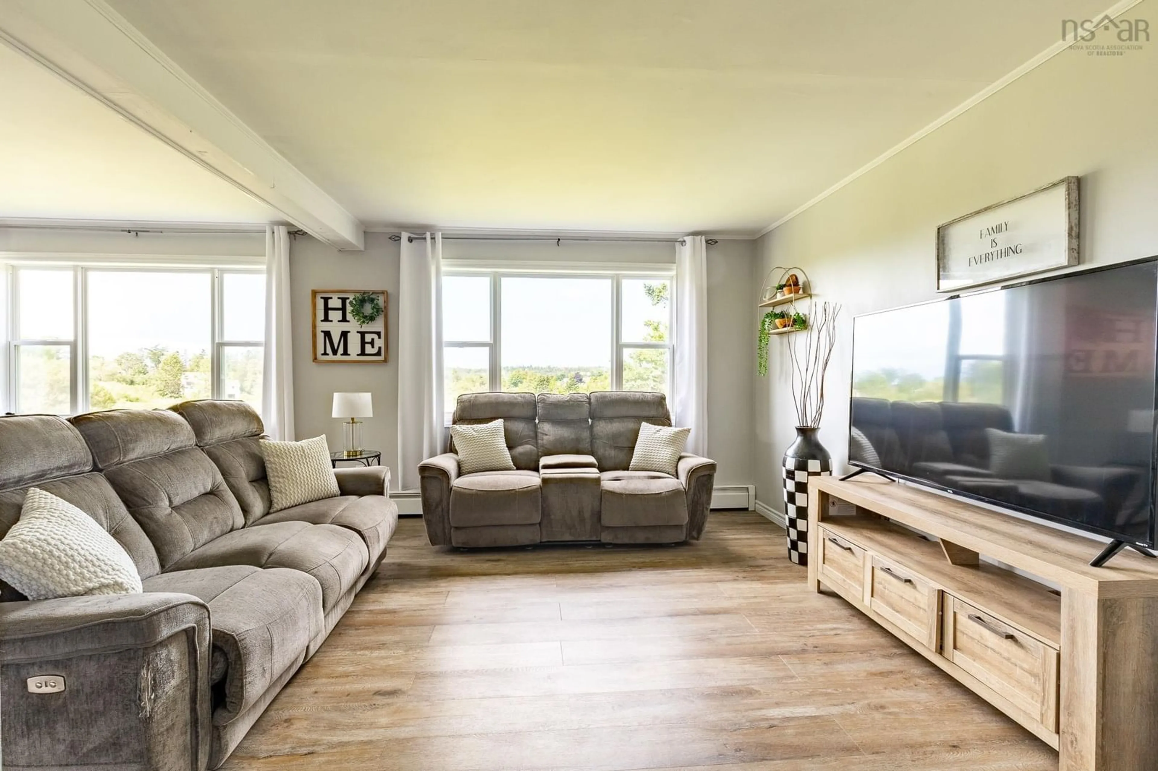 Living room with furniture, wood/laminate floor for 19 Spruce Lane, Hebron Nova Scotia B5A 5Z6