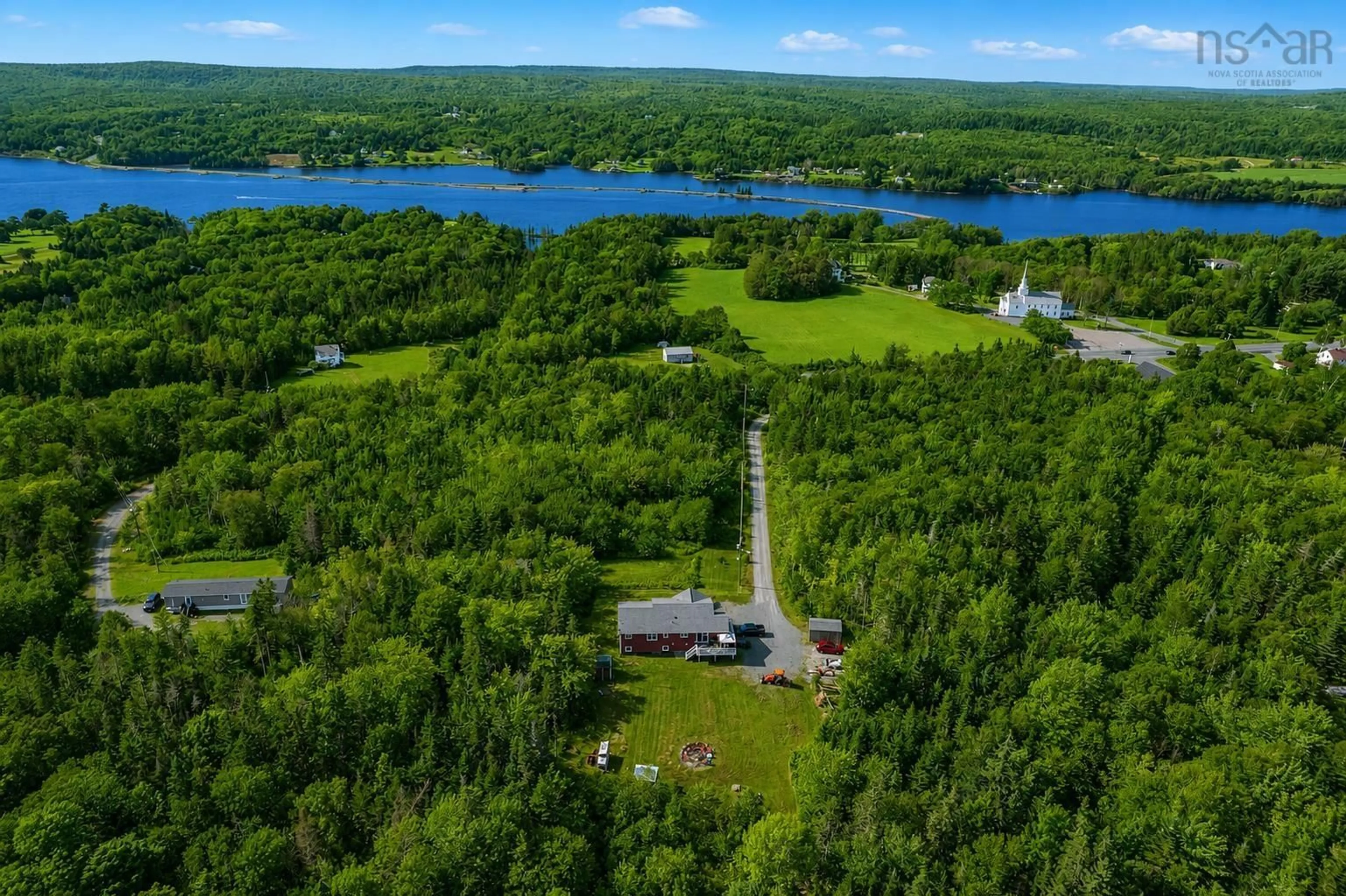A pic from outside/outdoor area/front of a property/back of a property/a pic from drone, water/lake/river/ocean view for 3975 East Bay Hwy, East Bay Nova Scotia B1J 1M4