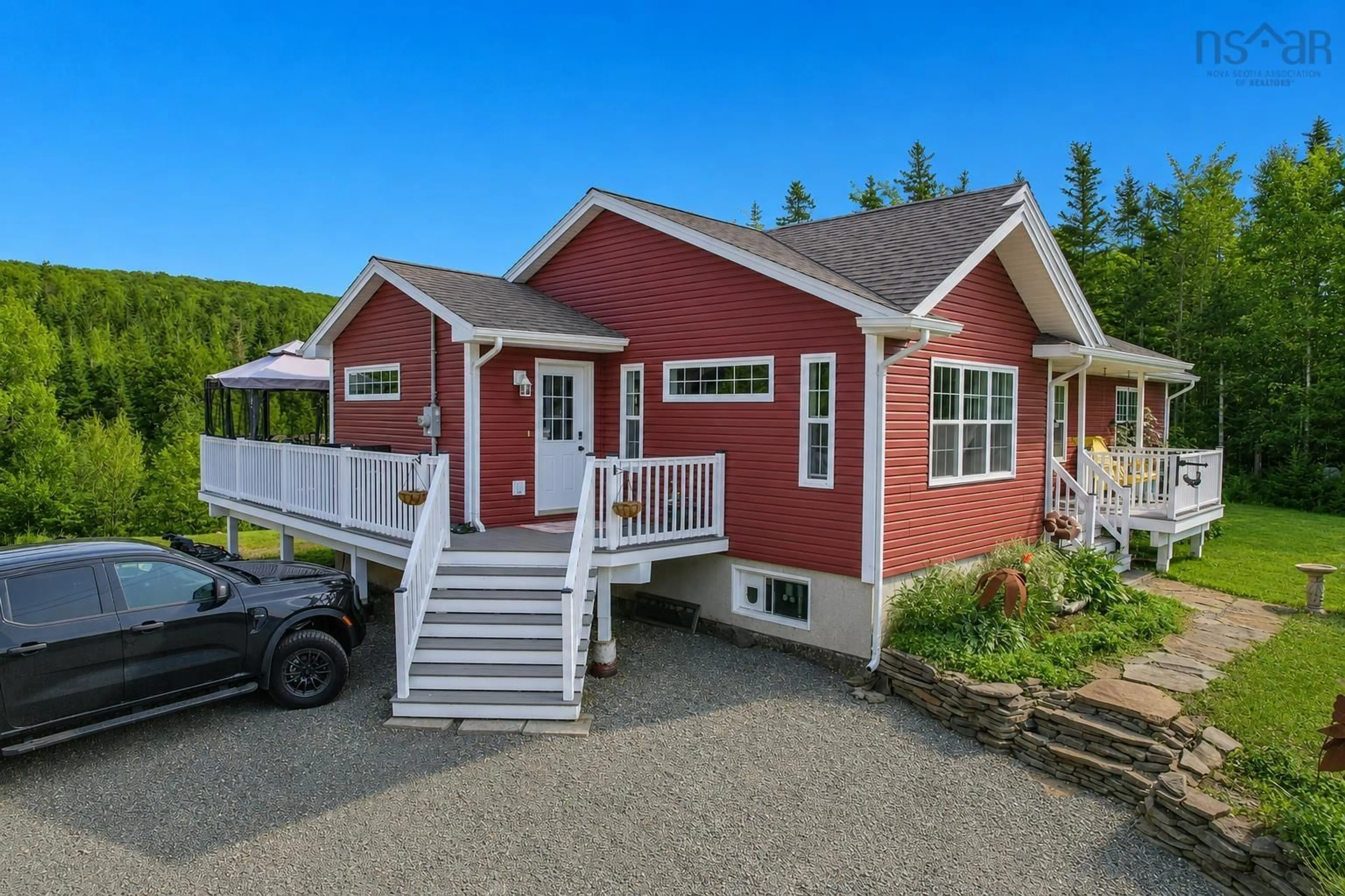 Home with vinyl exterior material, street for 3975 East Bay Hwy, East Bay Nova Scotia B1J 1M4