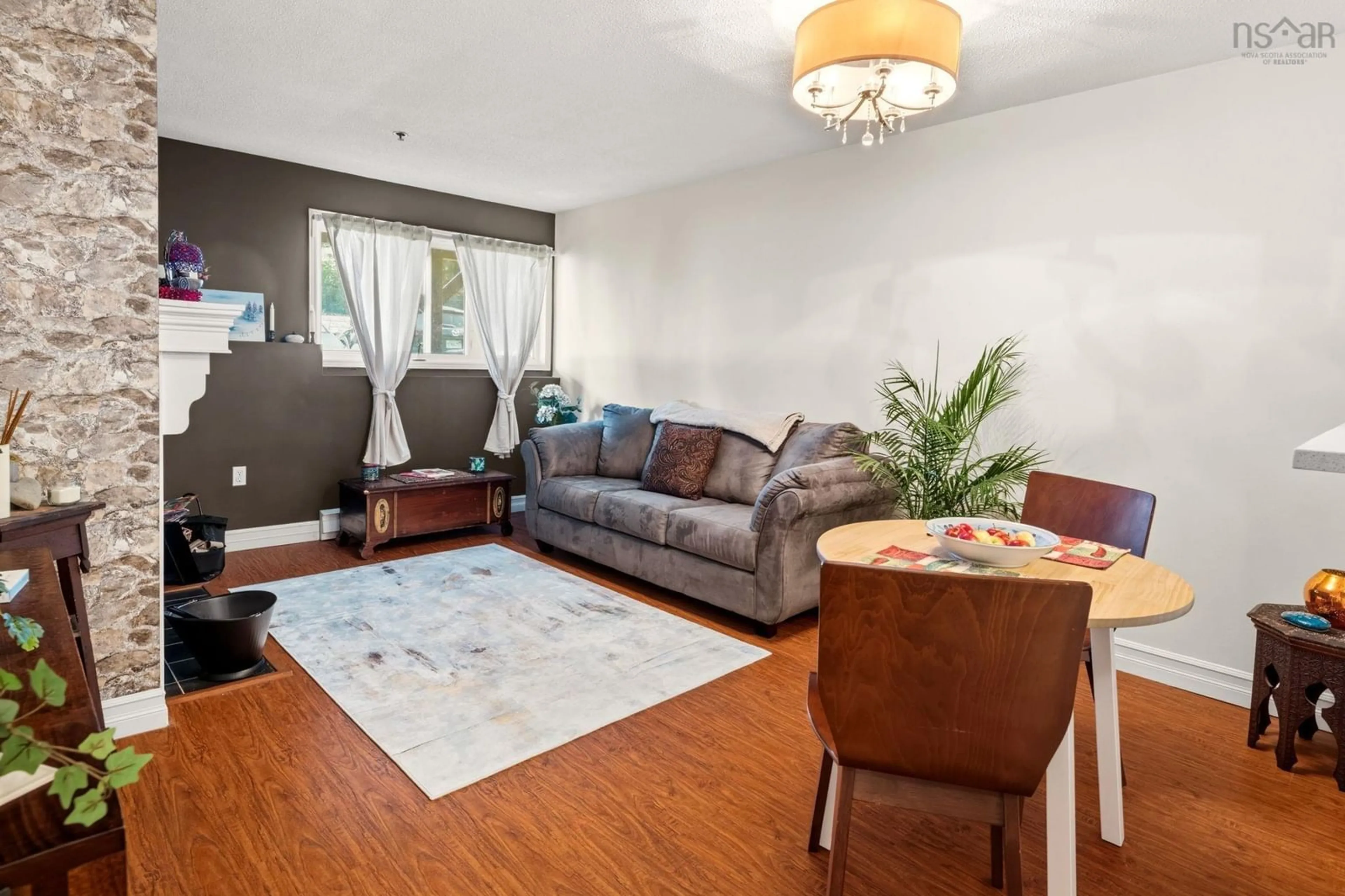 Living room with furniture, wood/laminate floor for 3700 John Parr Dr #208, Halifax Nova Scotia B3K 5V4