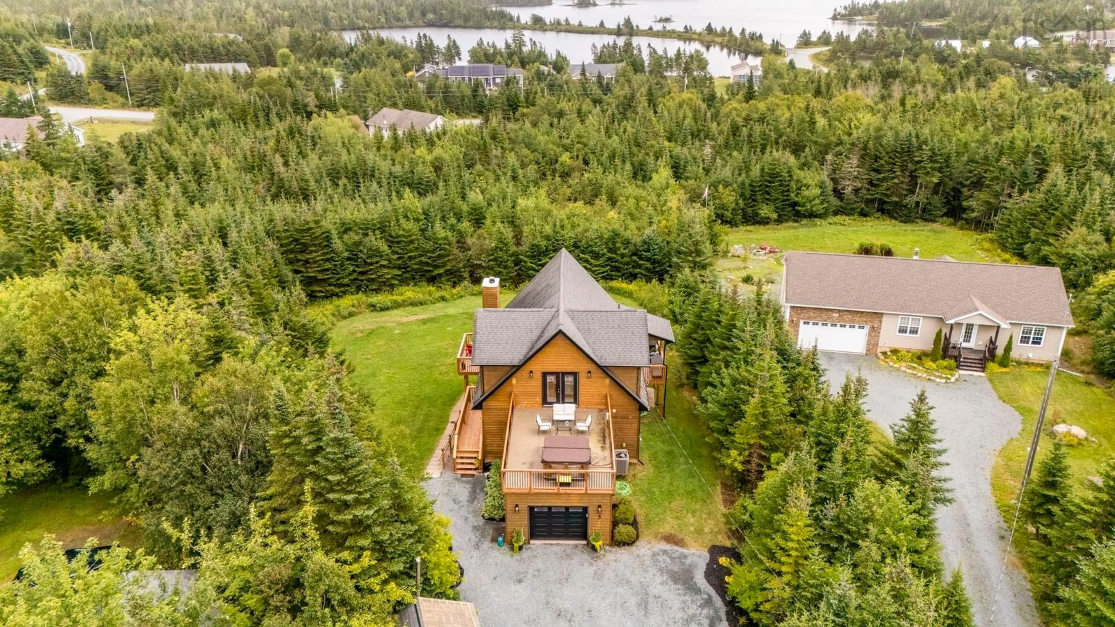 A pic from outside/outdoor area/front of a property/back of a property/a pic from drone, water/lake/river/ocean view for 5 Evergreen Cres, West Porters Lake Nova Scotia B3E 1L7