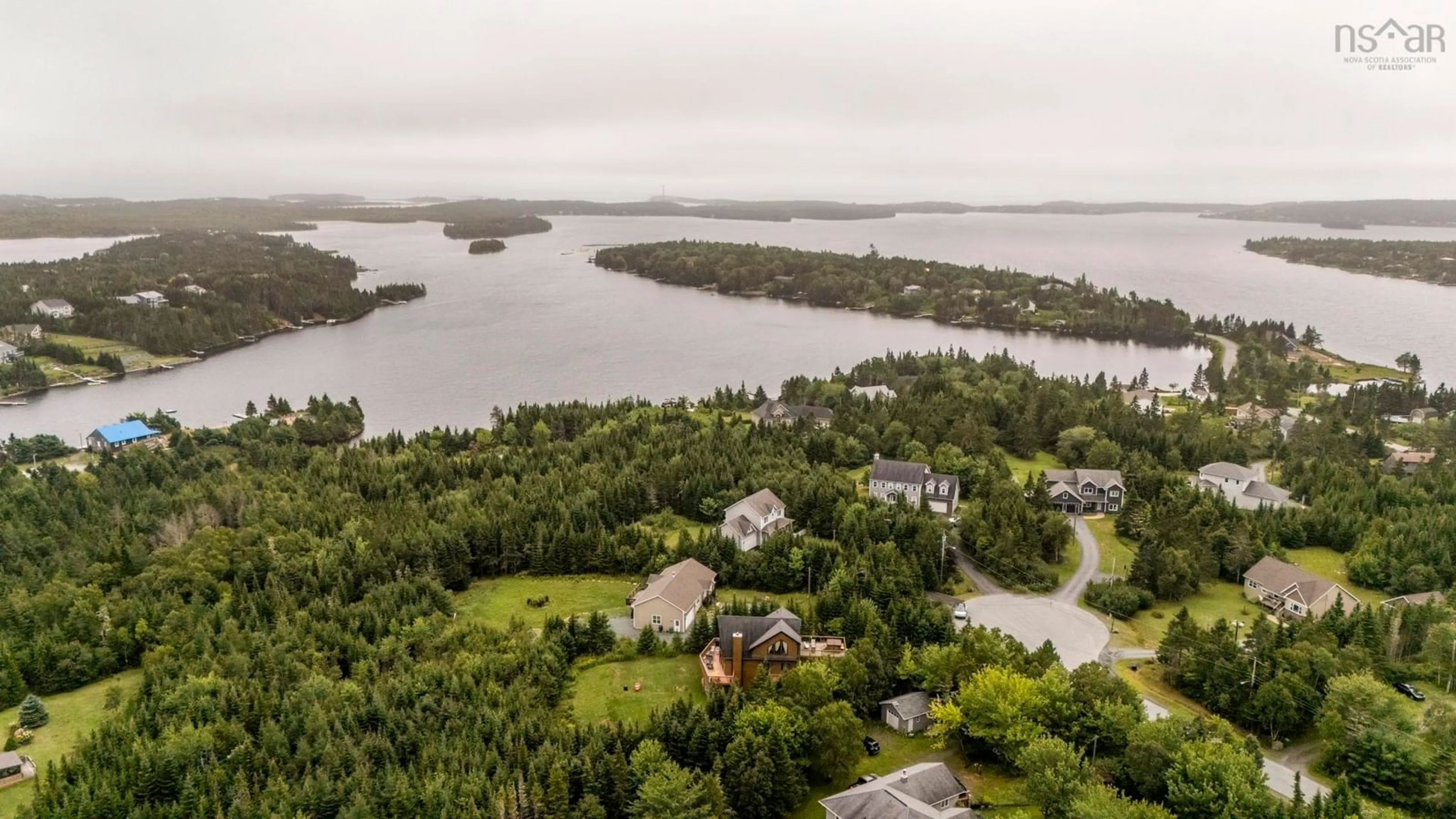 A pic from outside/outdoor area/front of a property/back of a property/a pic from drone, water/lake/river/ocean view for 5 Evergreen Cres, West Porters Lake Nova Scotia B3E 1L7