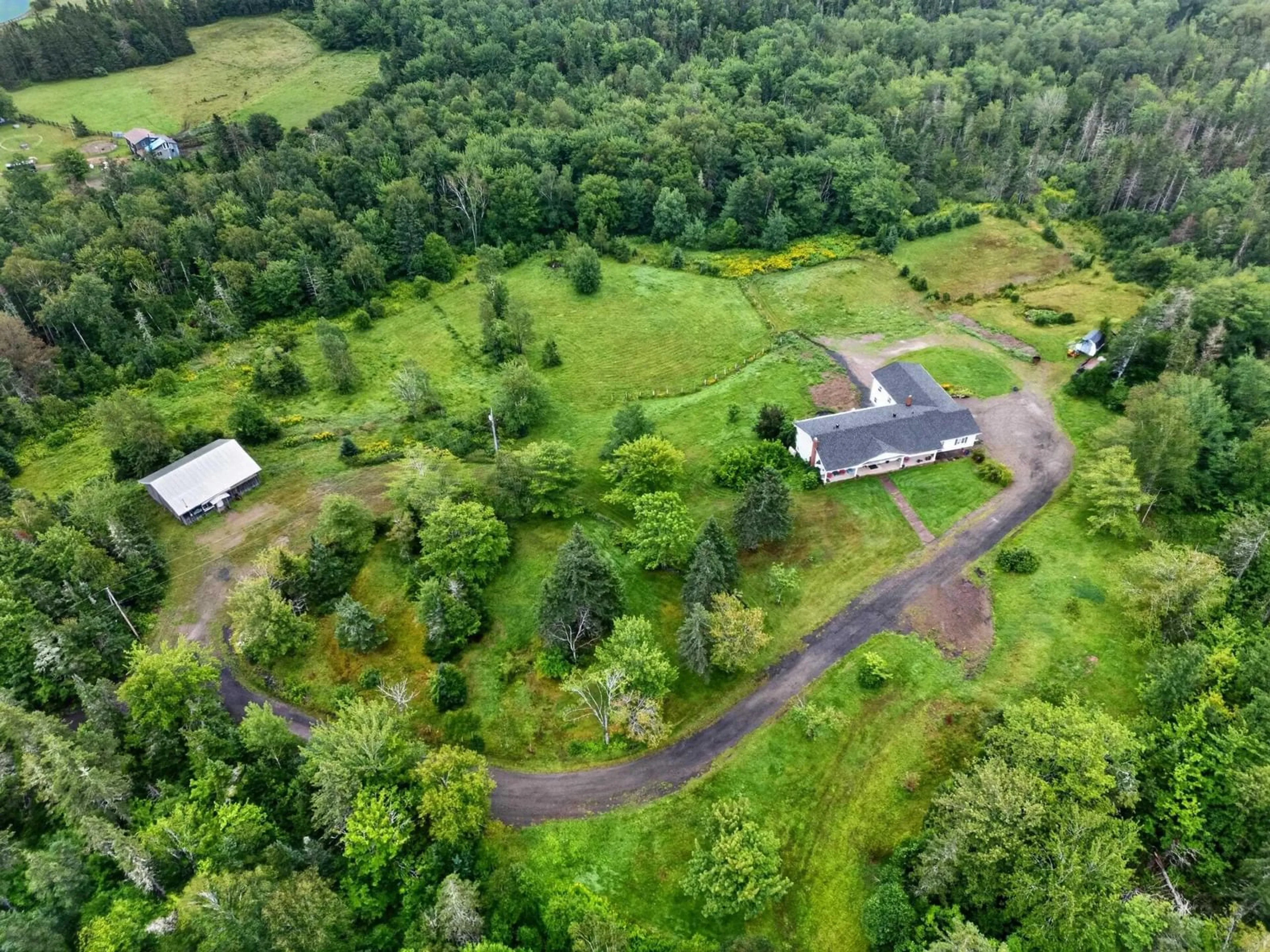 A pic from outside/outdoor area/front of a property/back of a property/a pic from drone, forest/trees view for 2489 Coxheath Rd, Coxheath Nova Scotia B1L 1A5