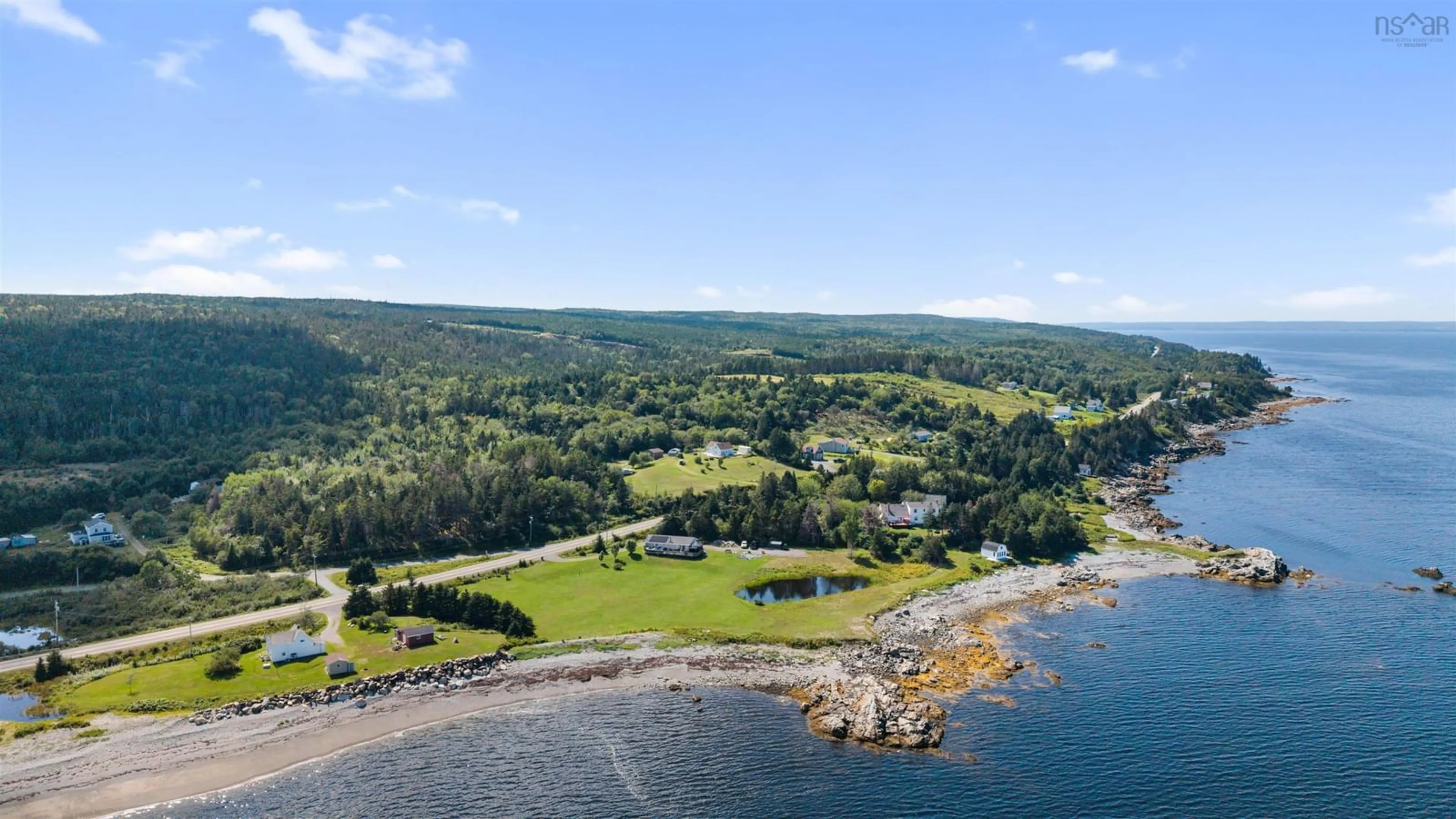 A pic from outside/outdoor area/front of a property/back of a property/a pic from drone, water/lake/river/ocean view for 5863 Highway 16, Queensport Nova Scotia B0H 1N0