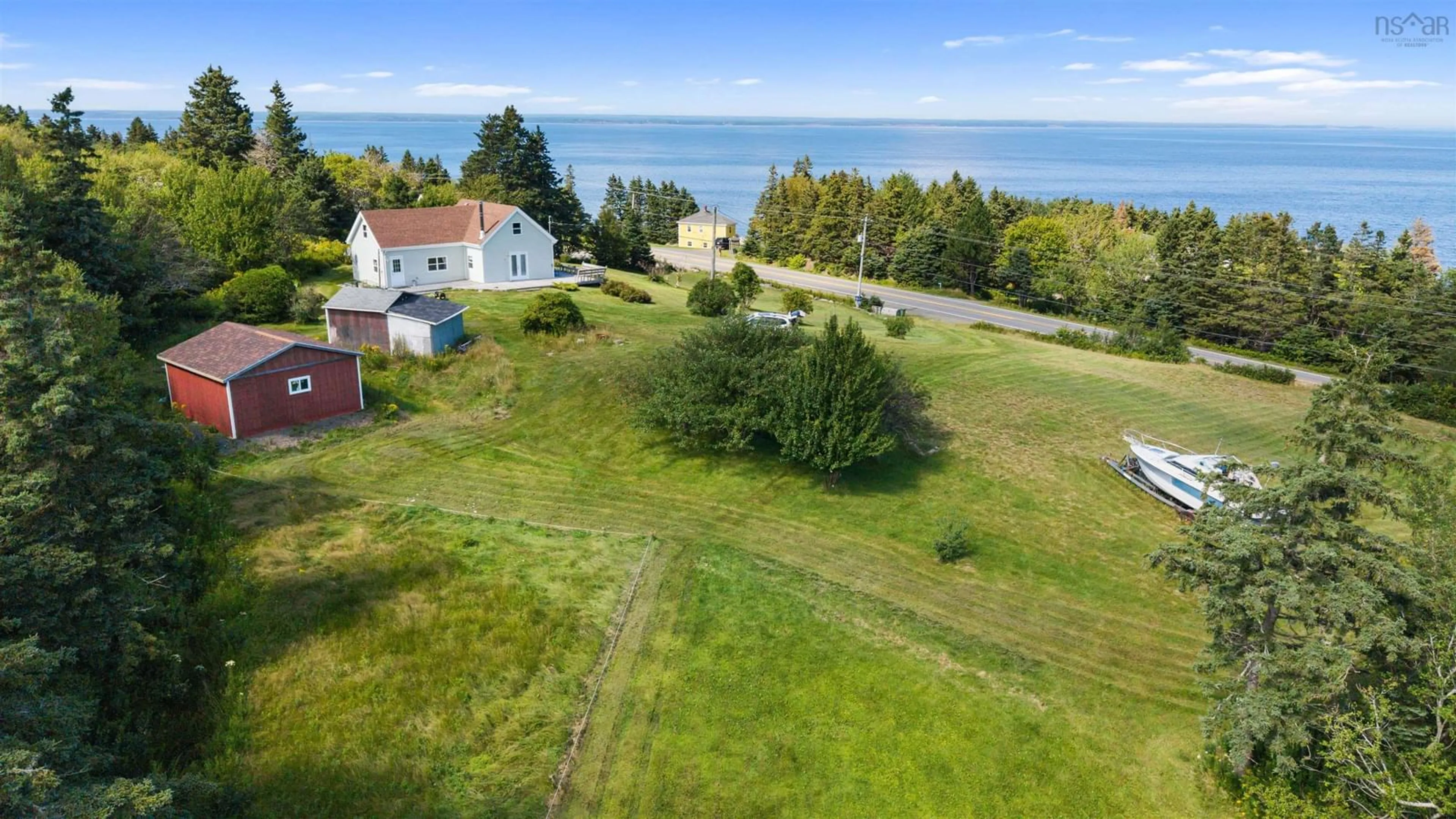 A pic from outside/outdoor area/front of a property/back of a property/a pic from drone, water/lake/river/ocean view for 5863 Highway 16, Queensport Nova Scotia B0H 1N0
