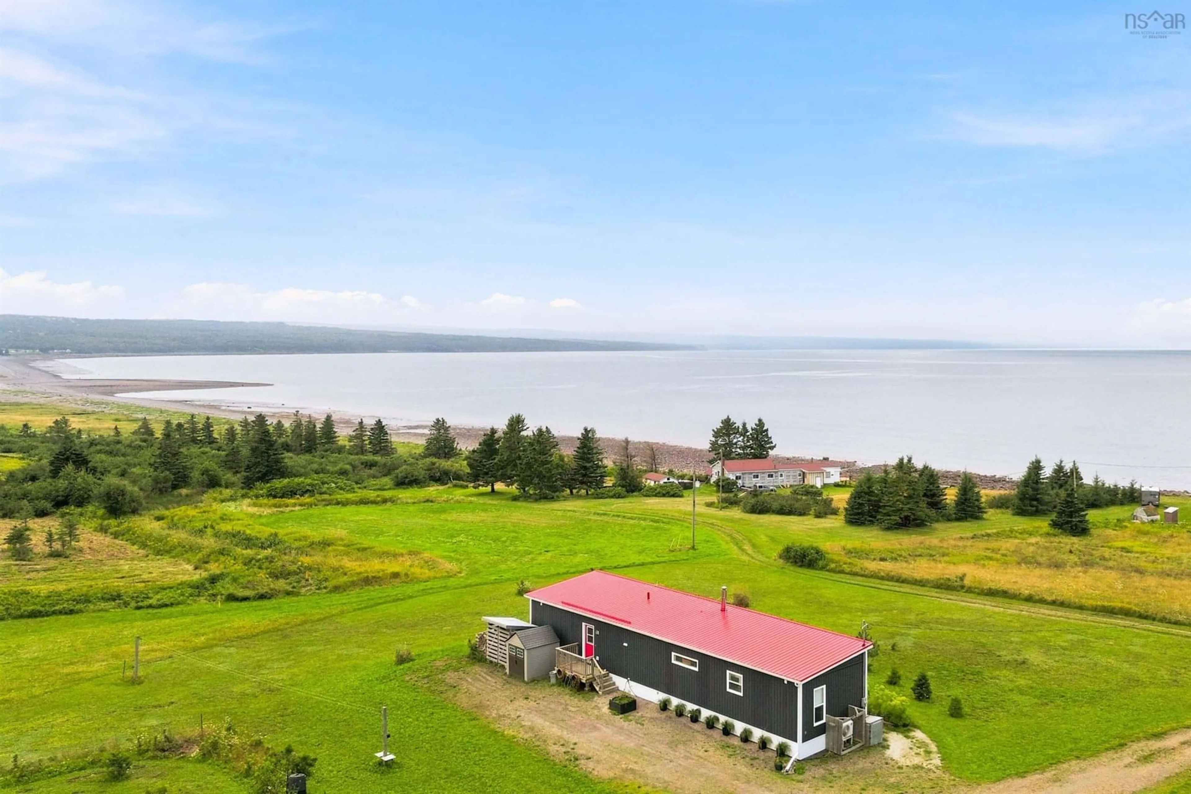A pic from outside/outdoor area/front of a property/back of a property/a pic from drone, water/lake/river/ocean view for 1474 Cape Split Rd, Scots Bay Nova Scotia B0P 1H0