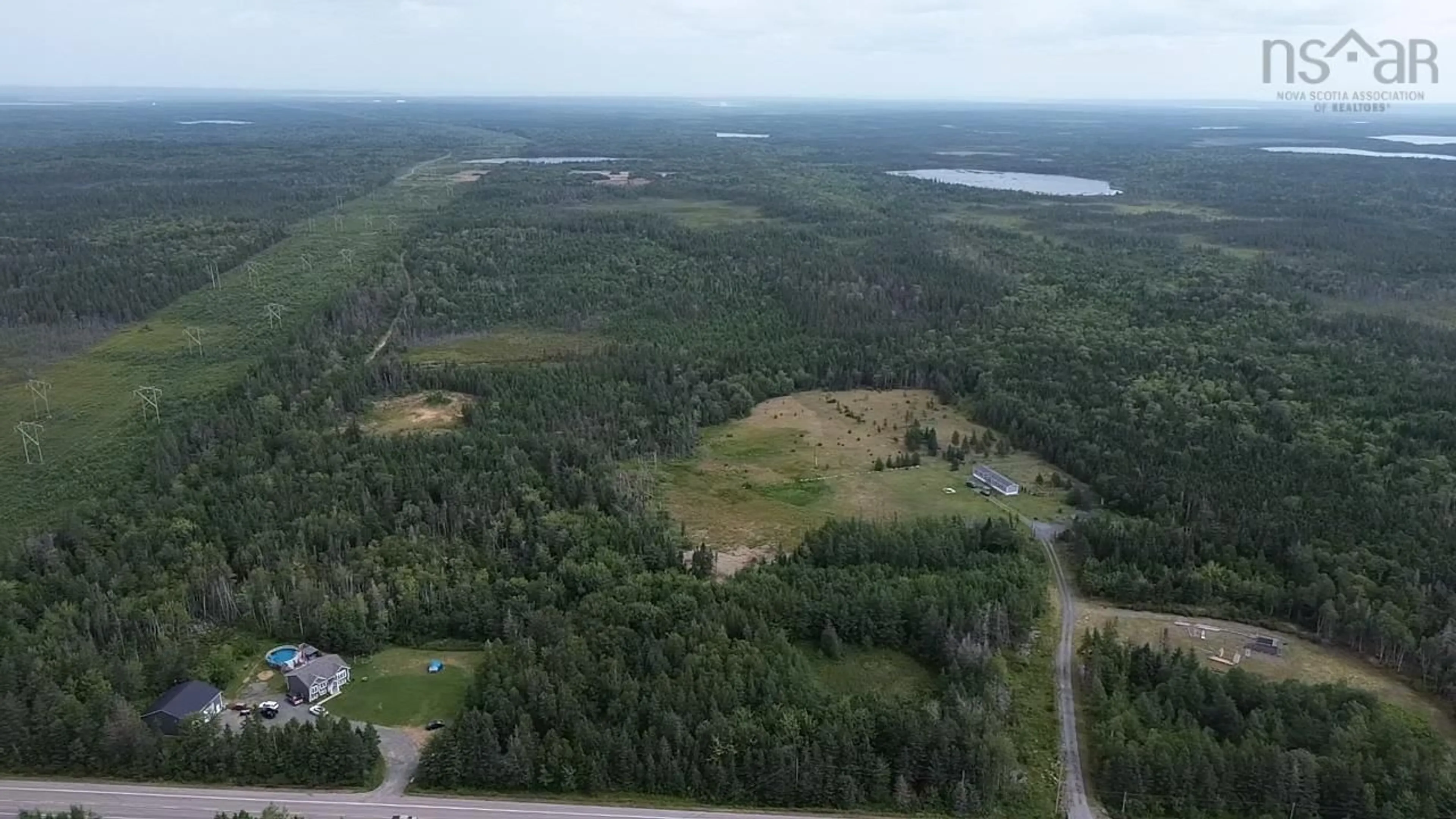 A pic from outside/outdoor area/front of a property/back of a property/a pic from drone, forest/trees view for 2185 Louisbourg Highway Hwy, Mira Road Nova Scotia B1M 1A9