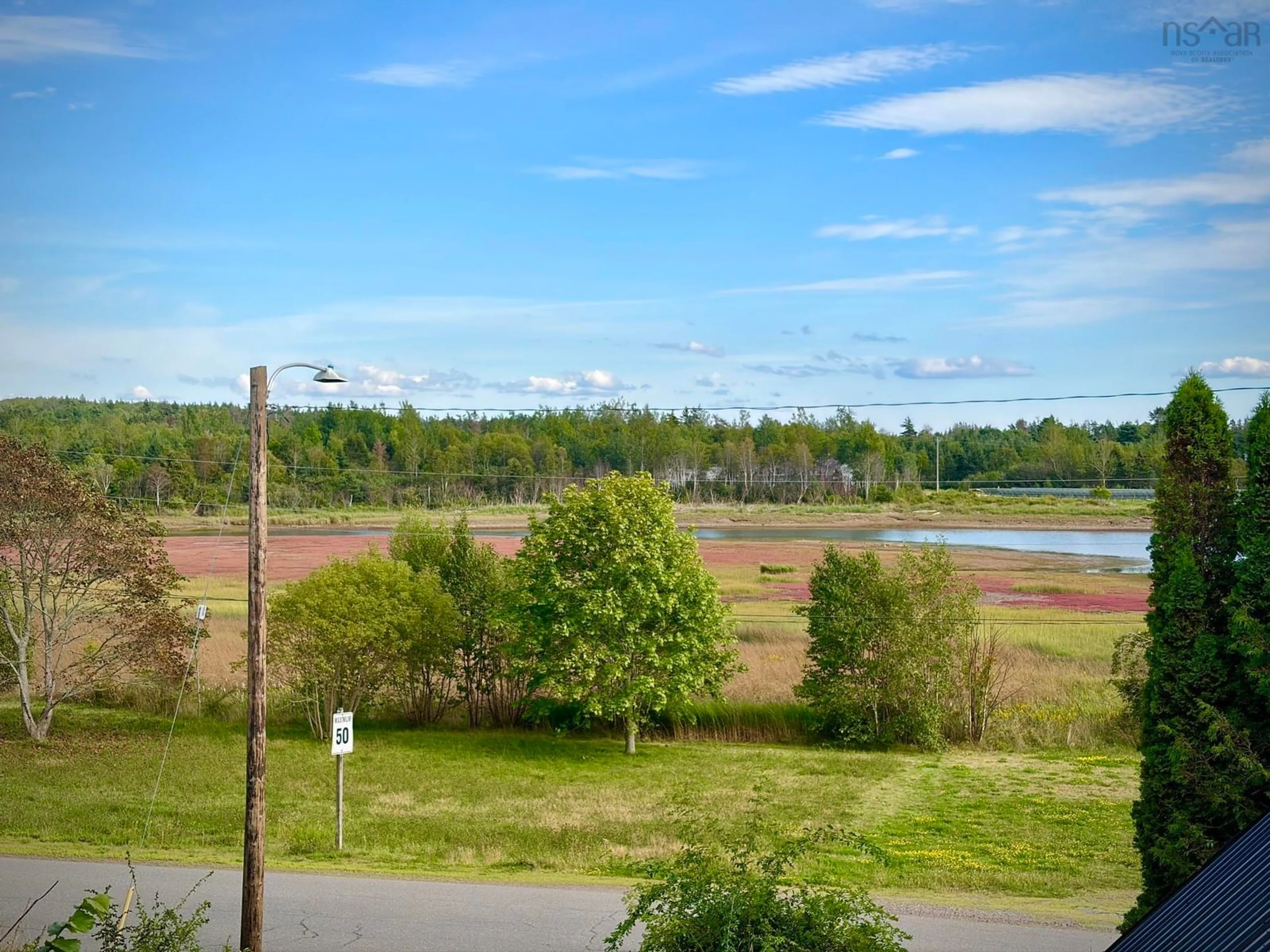 A pic from outside/outdoor area/front of a property/back of a property/a pic from drone, water/lake/river/ocean view for 94 Spring St, Parrsboro Nova Scotia B0M 1S0
