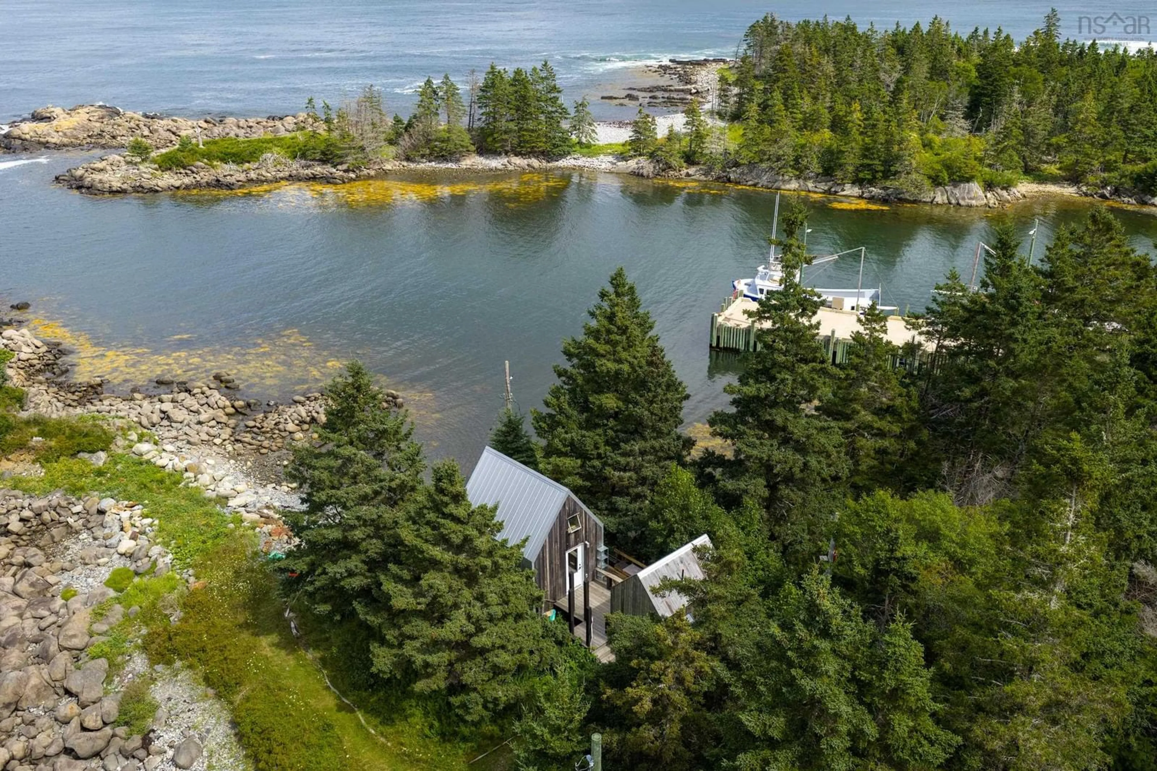 A pic from outside/outdoor area/front of a property/back of a property/a pic from drone, water/lake/river/ocean view for 61 Little Harbour Rd, Cherry Hill Nova Scotia B0J 2H0